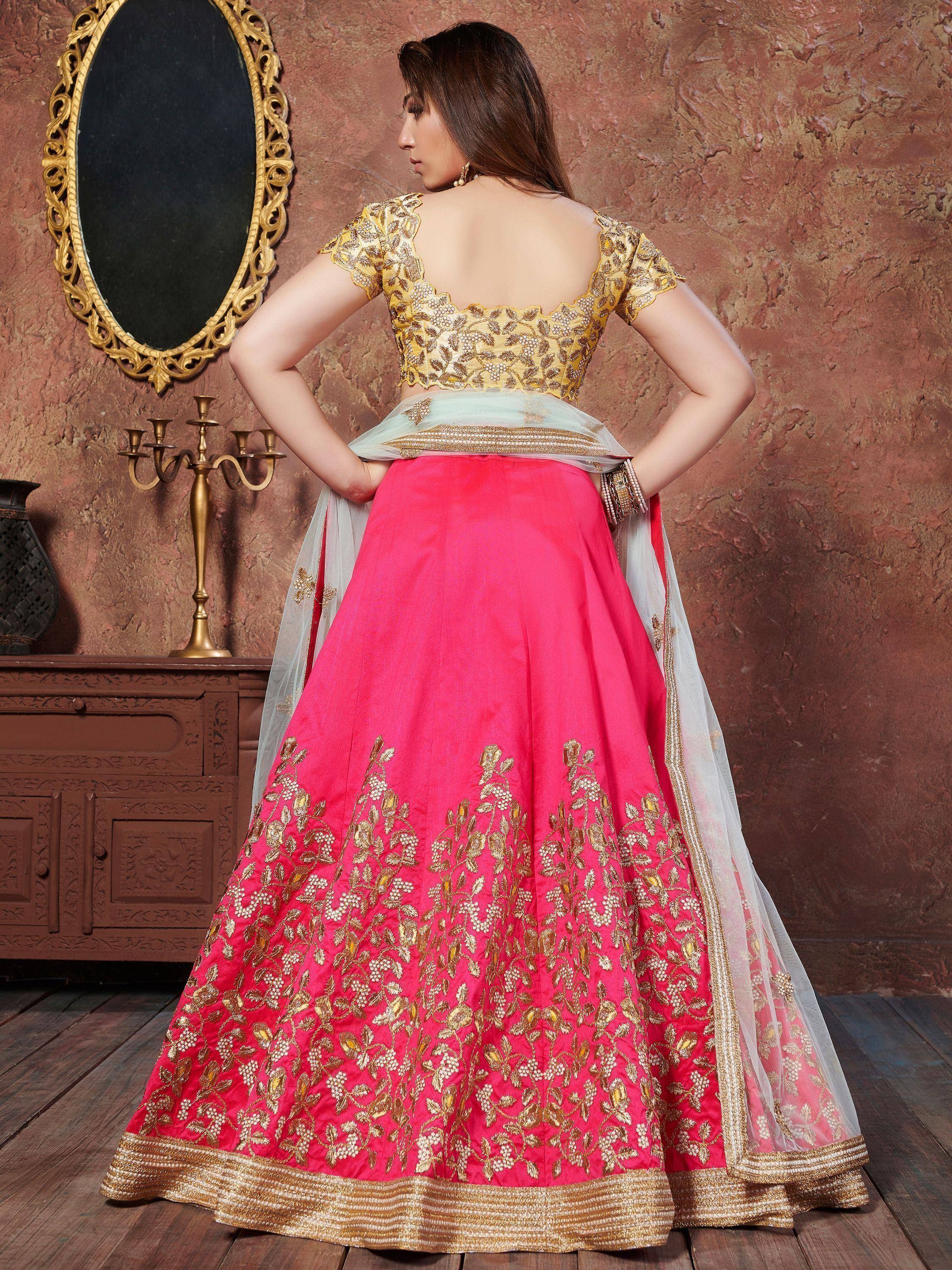 Pink and gold embroidered lehenga choli with floral design, perfect for Indian ethnic wear occasions.