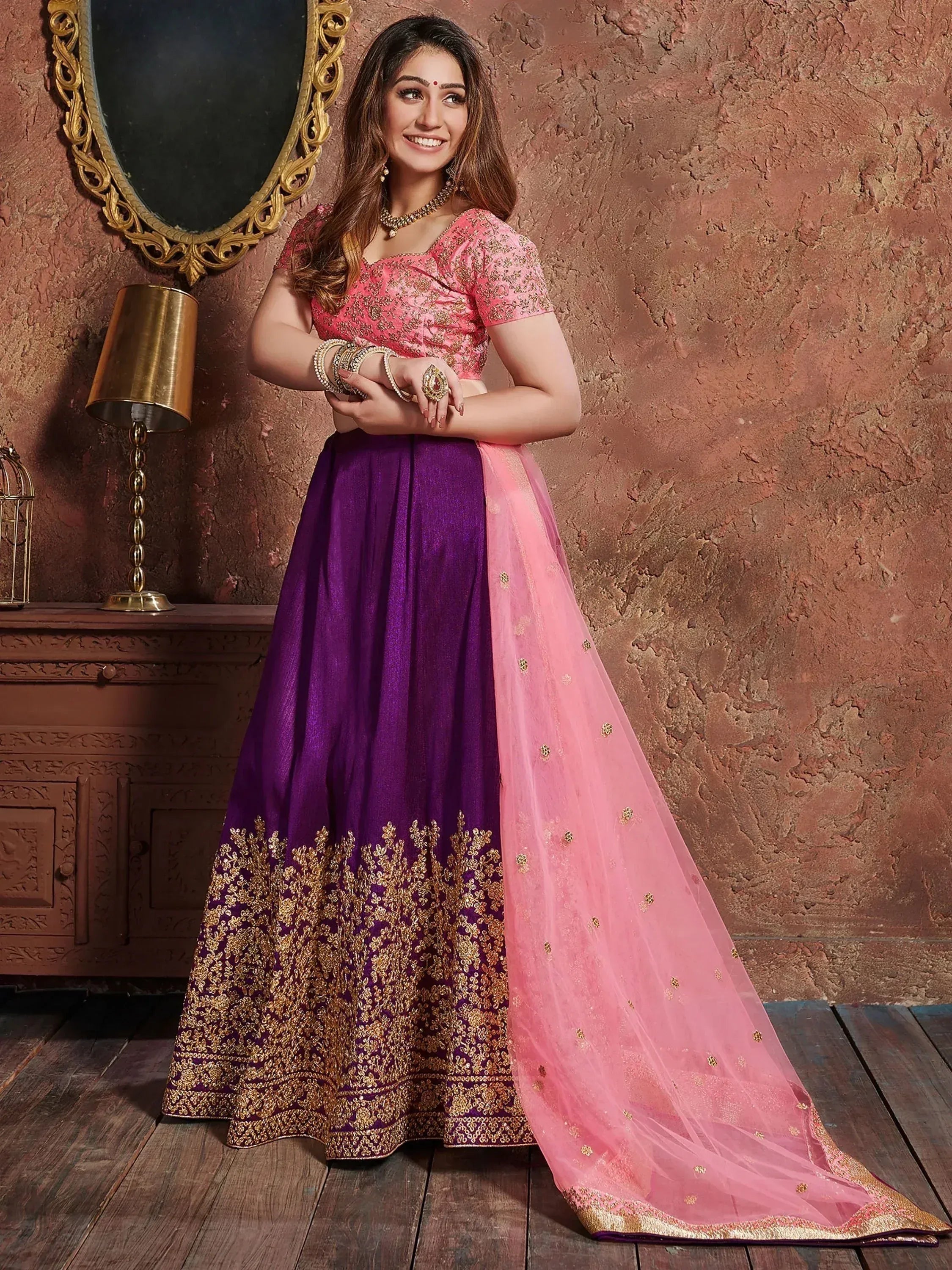 Pink and purple designer lehenga choli with gold embroidery, perfect for Indian ethnic wear occasions