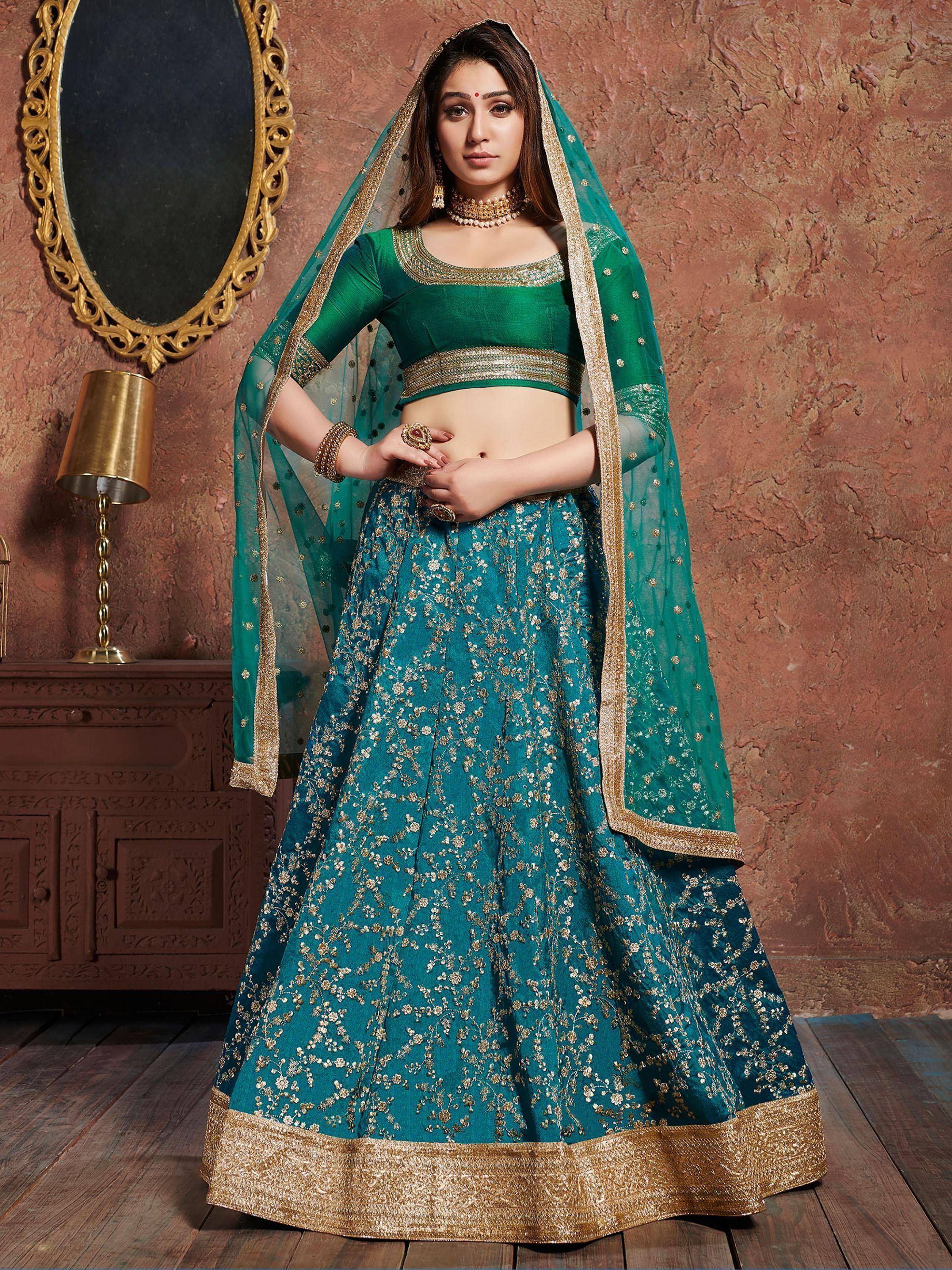 Emerald green designer lehenga choli with gold embroidery and dupatta, perfect for Indian weddings and festive occasions.