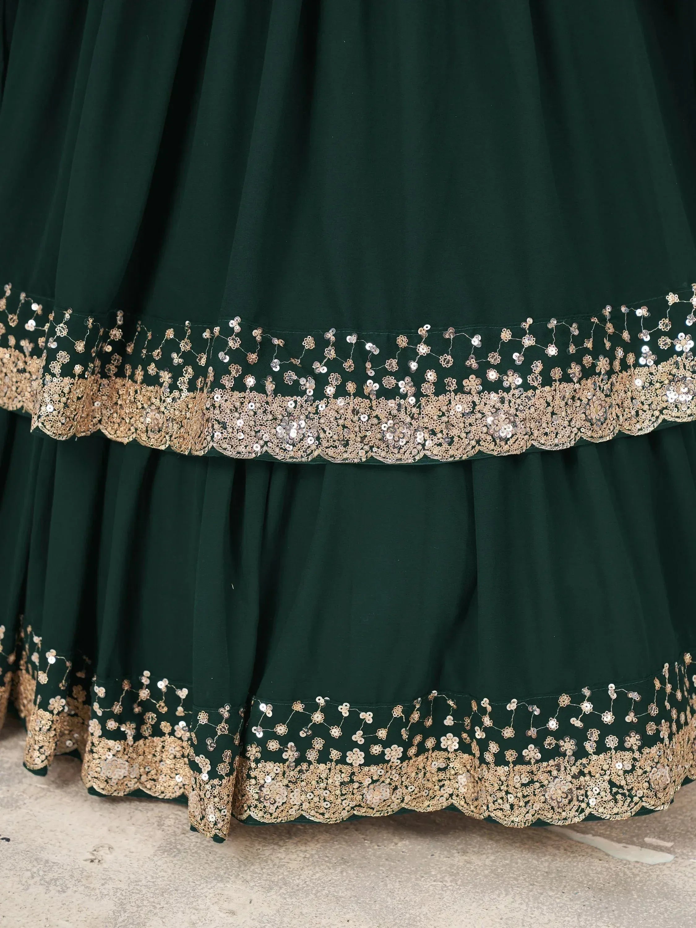 Emerald green lehenga with gold floral embroidery and sequin detailing, ethnic Indian wear