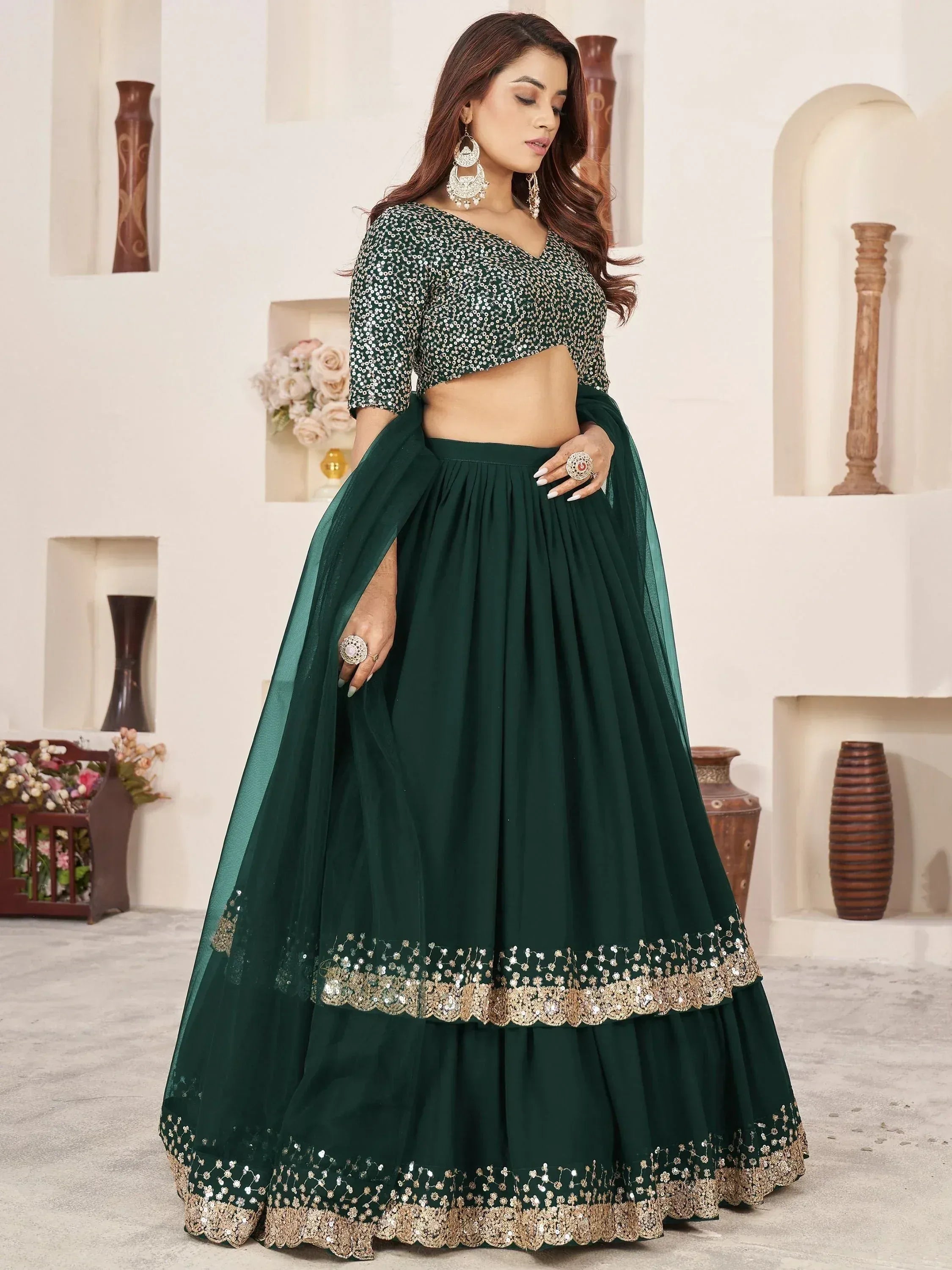 Emerald green sequin lehenga choli with gold embroidery, perfect for Indian weddings and festive occasions