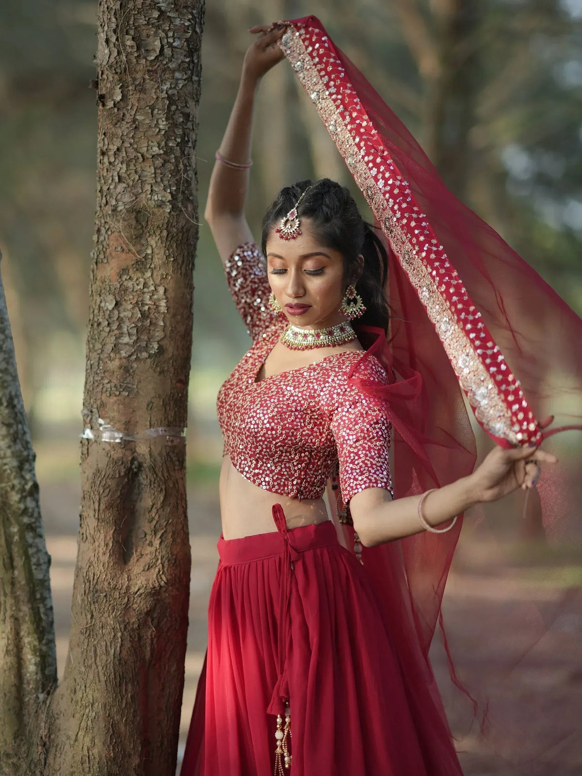 Elegant red sequin lehenga choli with matching dupatta, perfect for Indian ethnic occasions