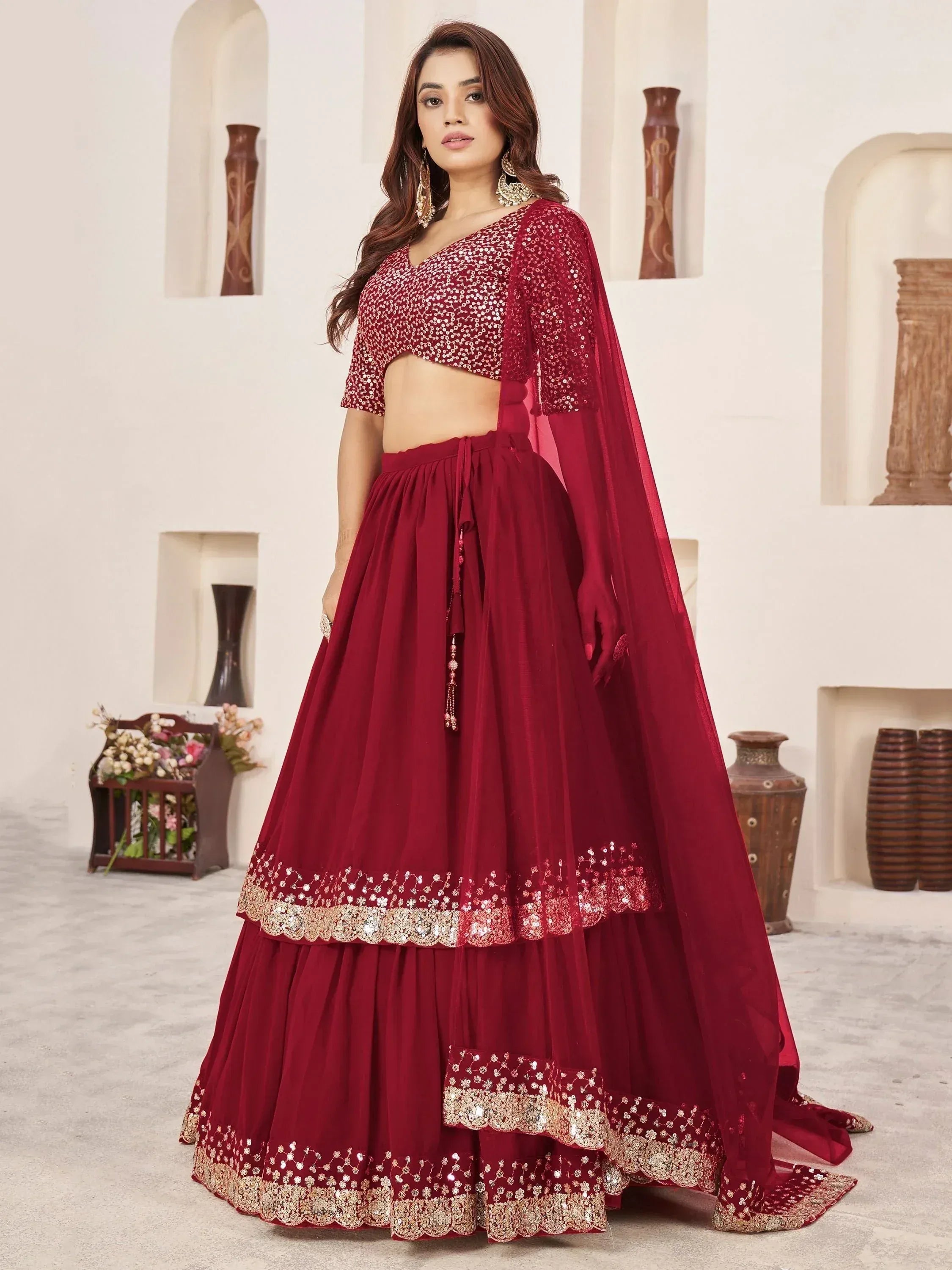 Maroon sequin lehenga choli with gold embroidery, perfect for Indian ethnic wear and festive occasions.