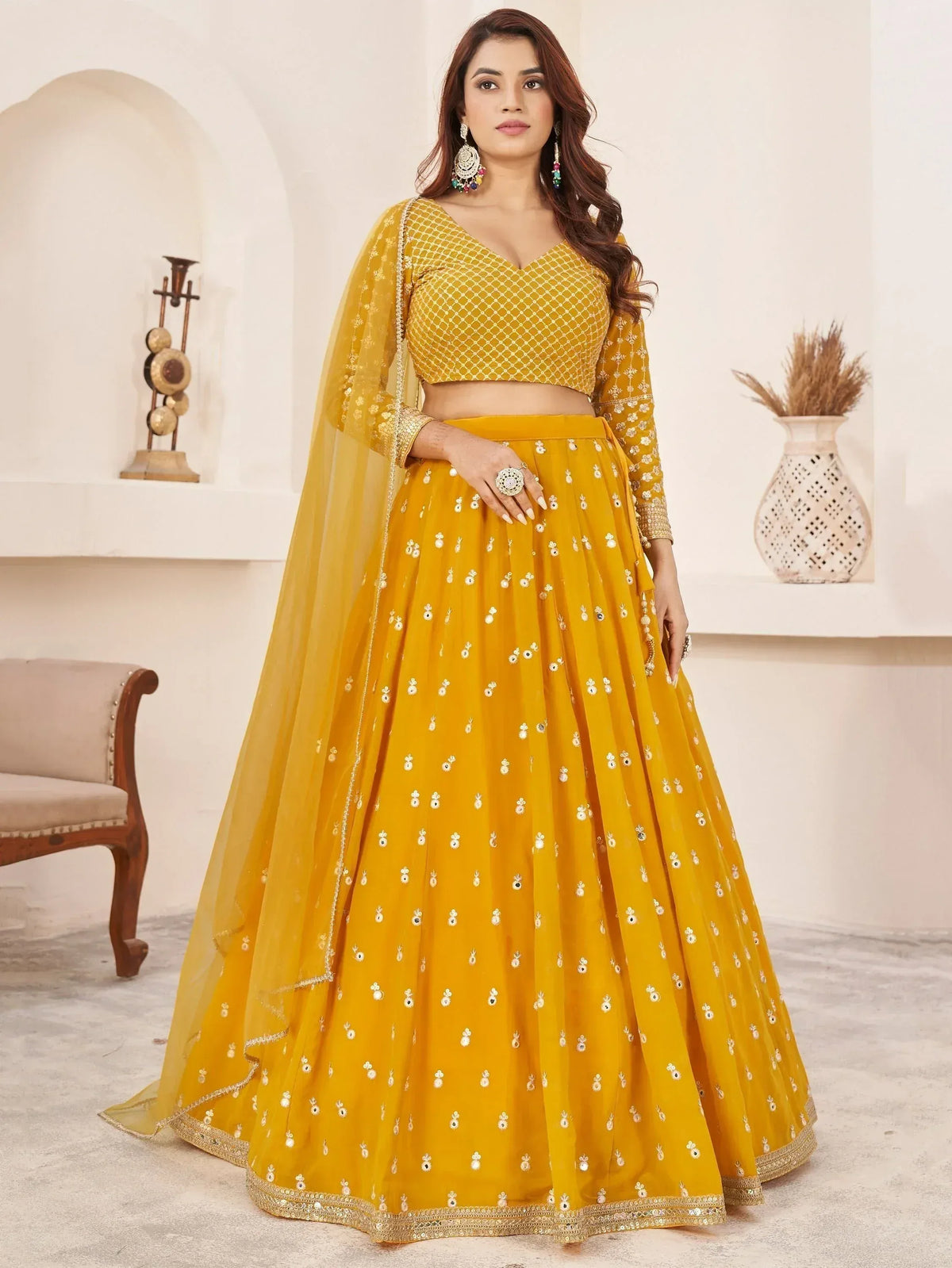 Mustard yellow designer lehenga choli with mirror work and net dupatta for Indian ethnic wear