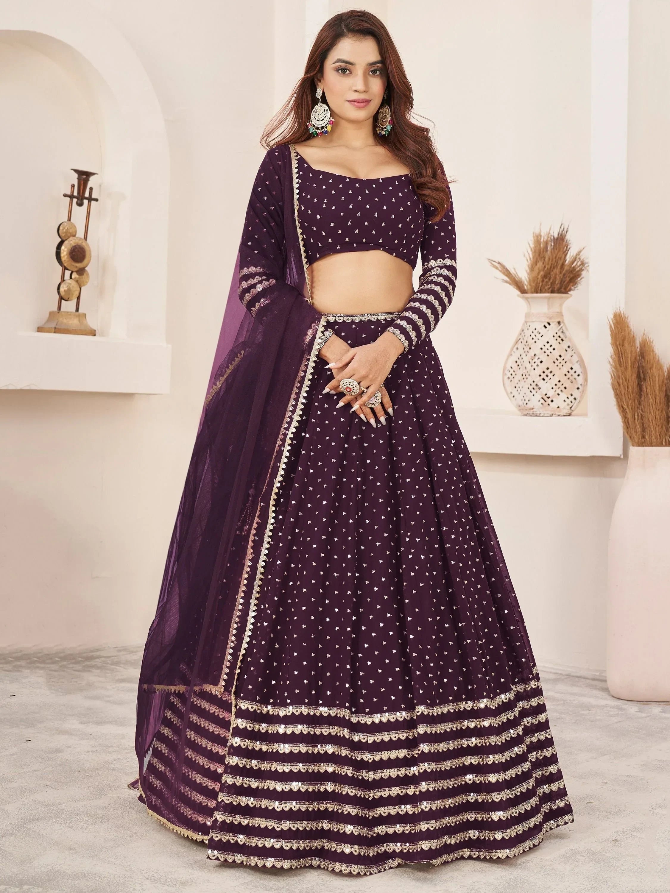 Purple designer lehenga choli with gold embroidery and sequins, perfect for Indian ethnic wear occasions.