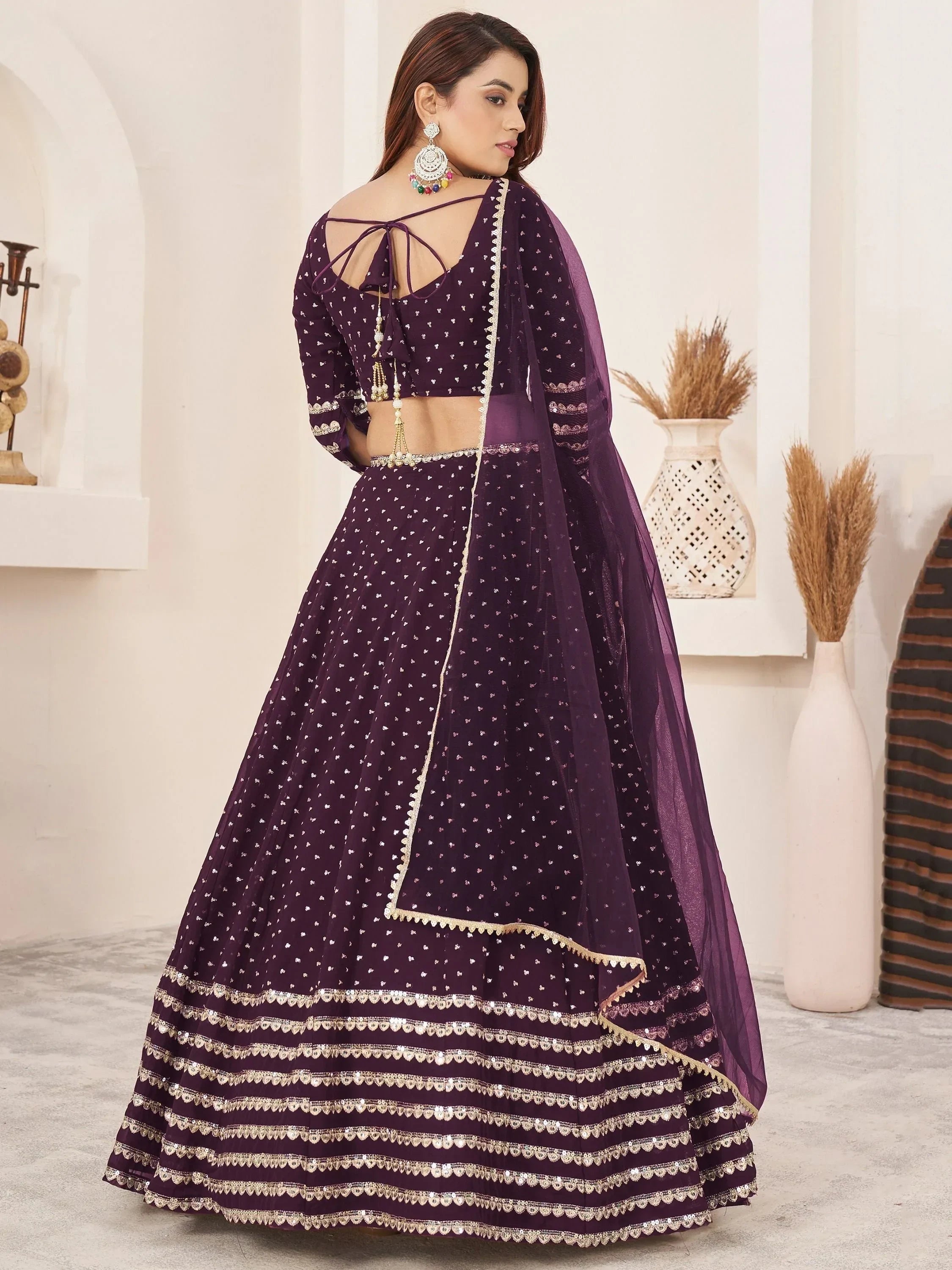 Purple designer lehenga choli with gold embroidery, perfect for Indian ethnic wear and festive occasions.
