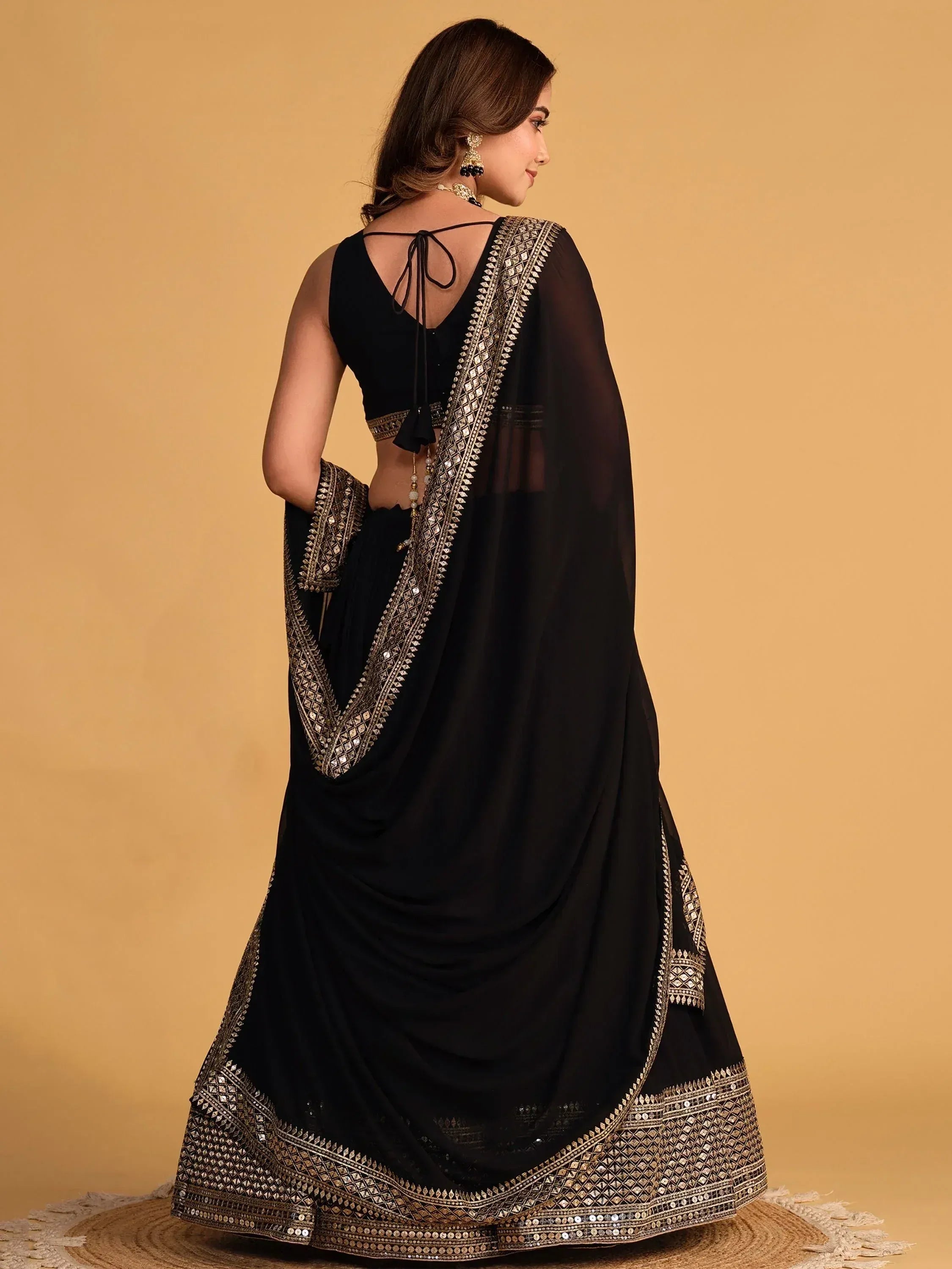 Black ethnic saree with gold mirror work and back tie blouse, perfect for Indian occasions