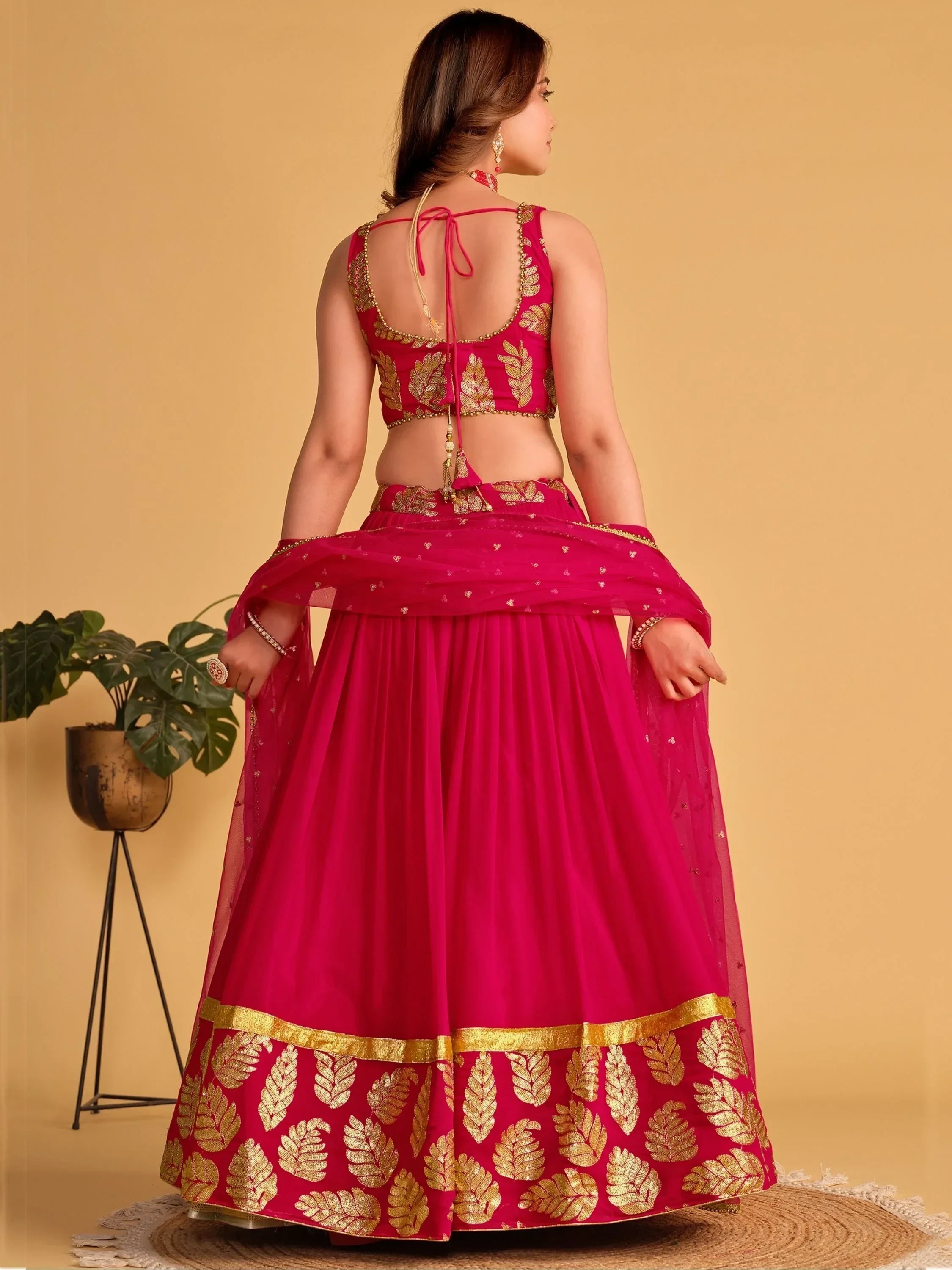Pink lehenga choli with gold leaf embroidery, back view, ethnic Indian wear for women