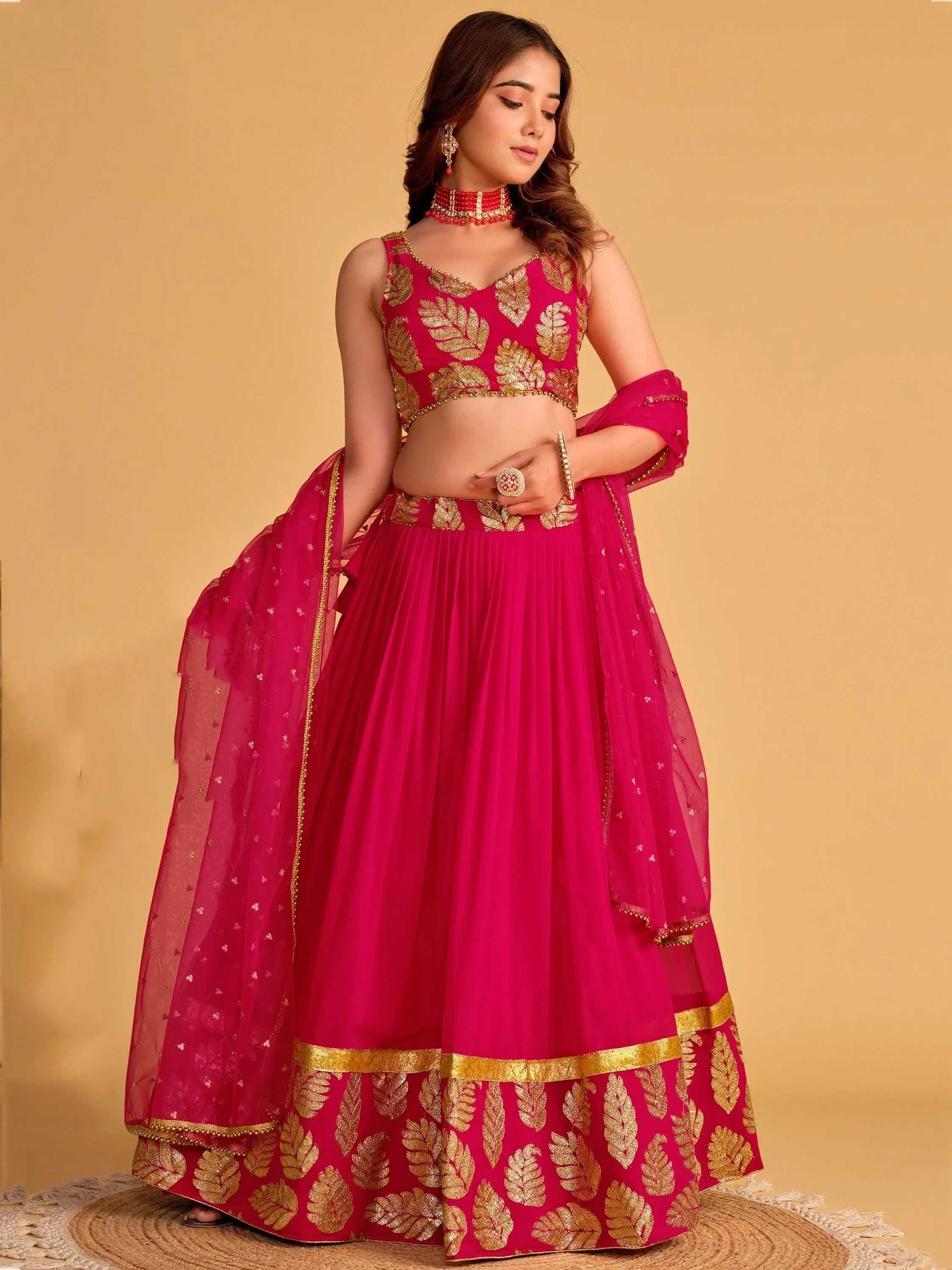 Pink lehenga choli with gold leaf embroidery, perfect for Indian ethnic wear and festive occasions