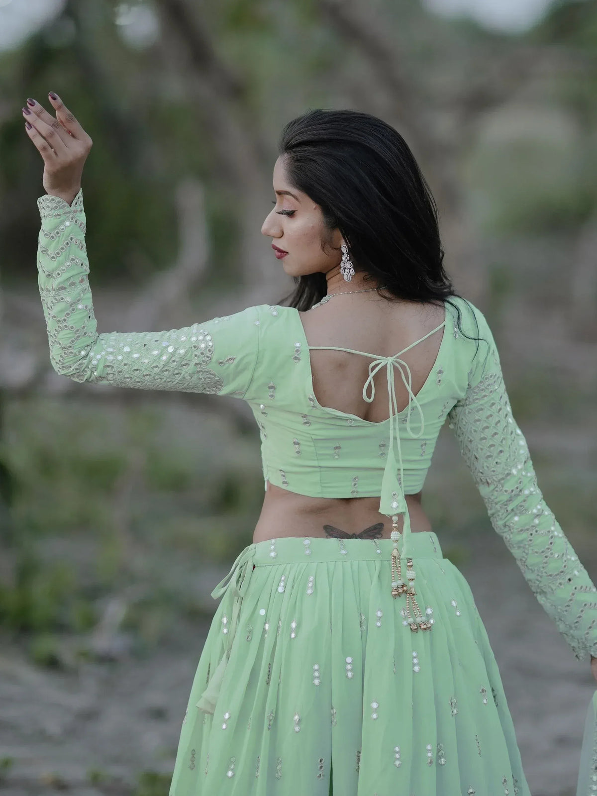 Mint green embroidered lehenga choli with back tie design, perfect for ethnic wear
