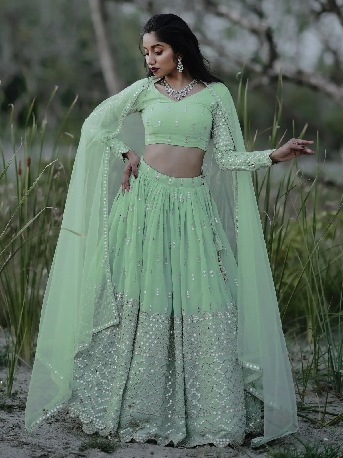Mint green embroidered lehenga choli with sheer dupatta, perfect for Indian ethnic wear