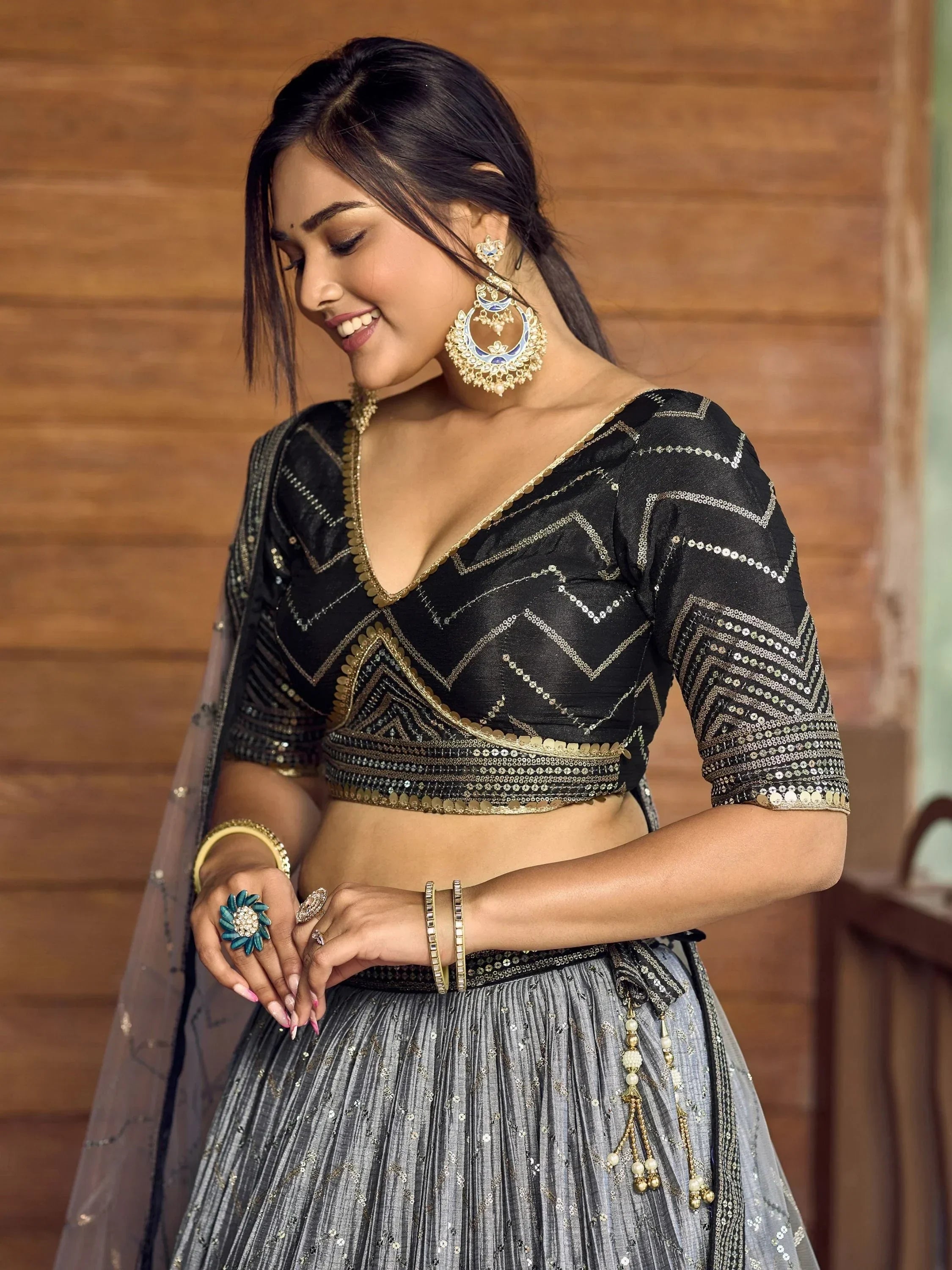 Black and silver embroidered lehenga choli with gold detailing, perfect for Indian ethnic wear occasions