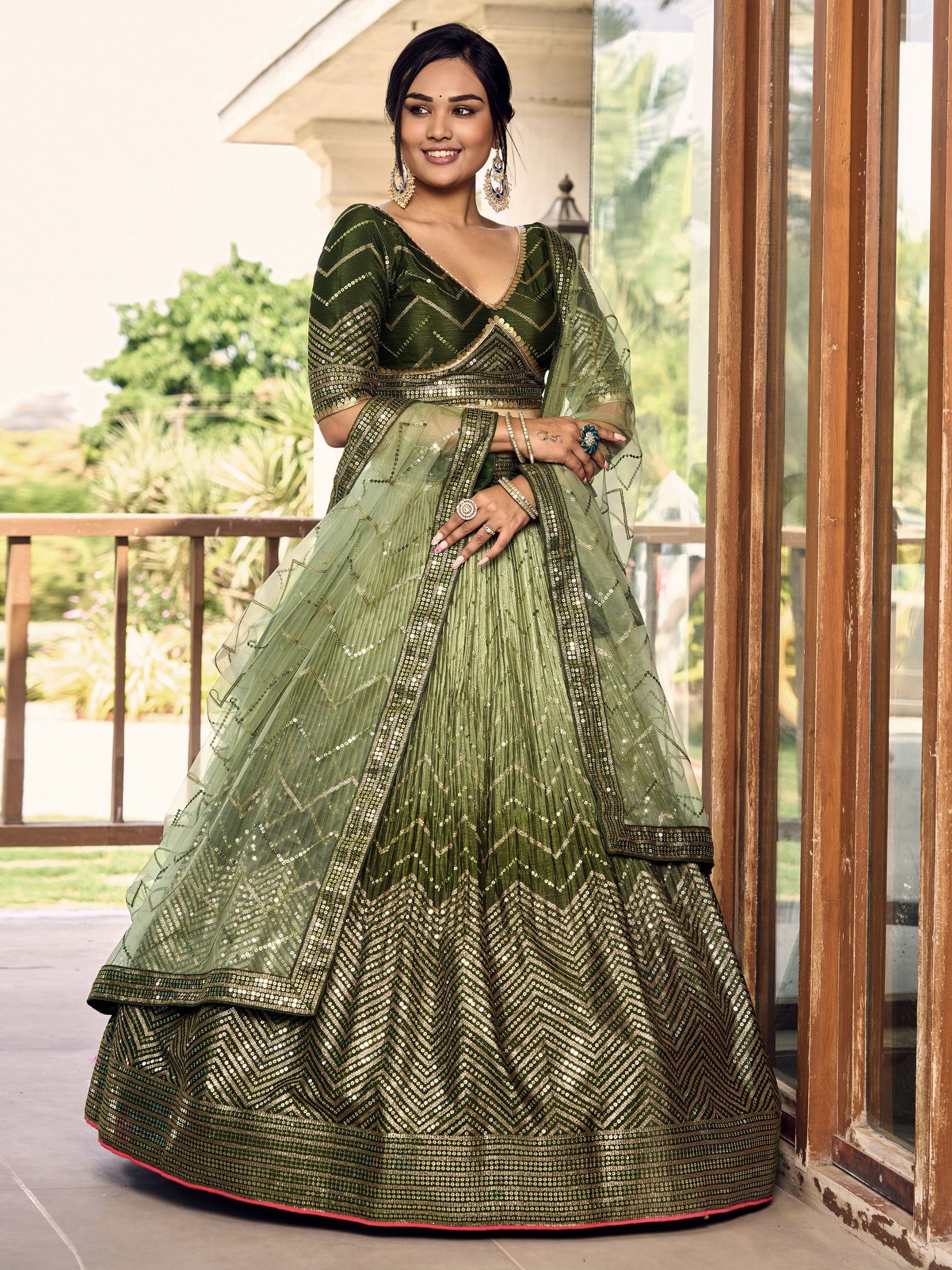 Green sequin lehenga choli with gold chevron embroidery, perfect for Indian weddings and festive occasions.