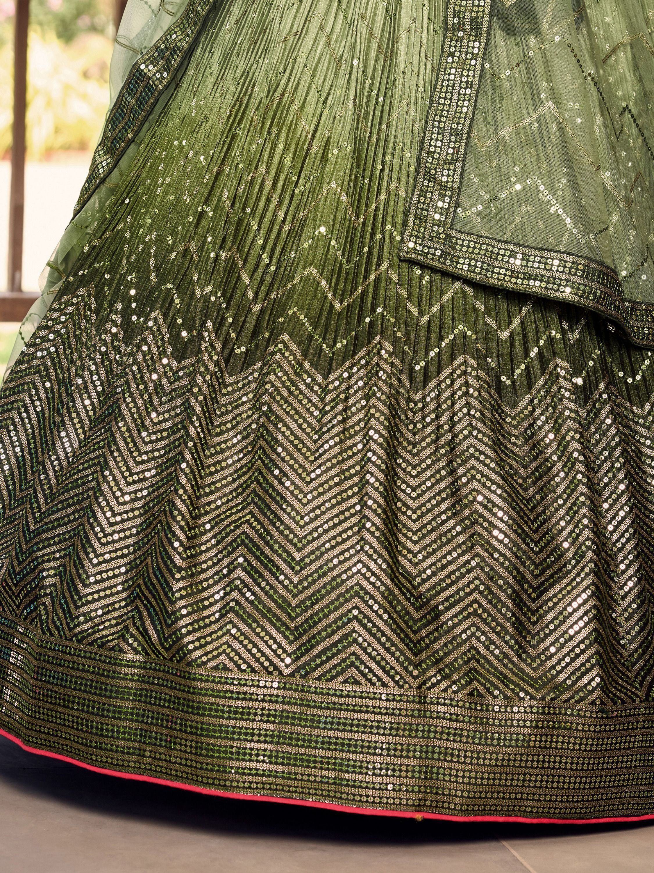 Olive green lehenga with intricate sequin chevron patterns and pleated skirt, ideal for Indian ethnic wear.