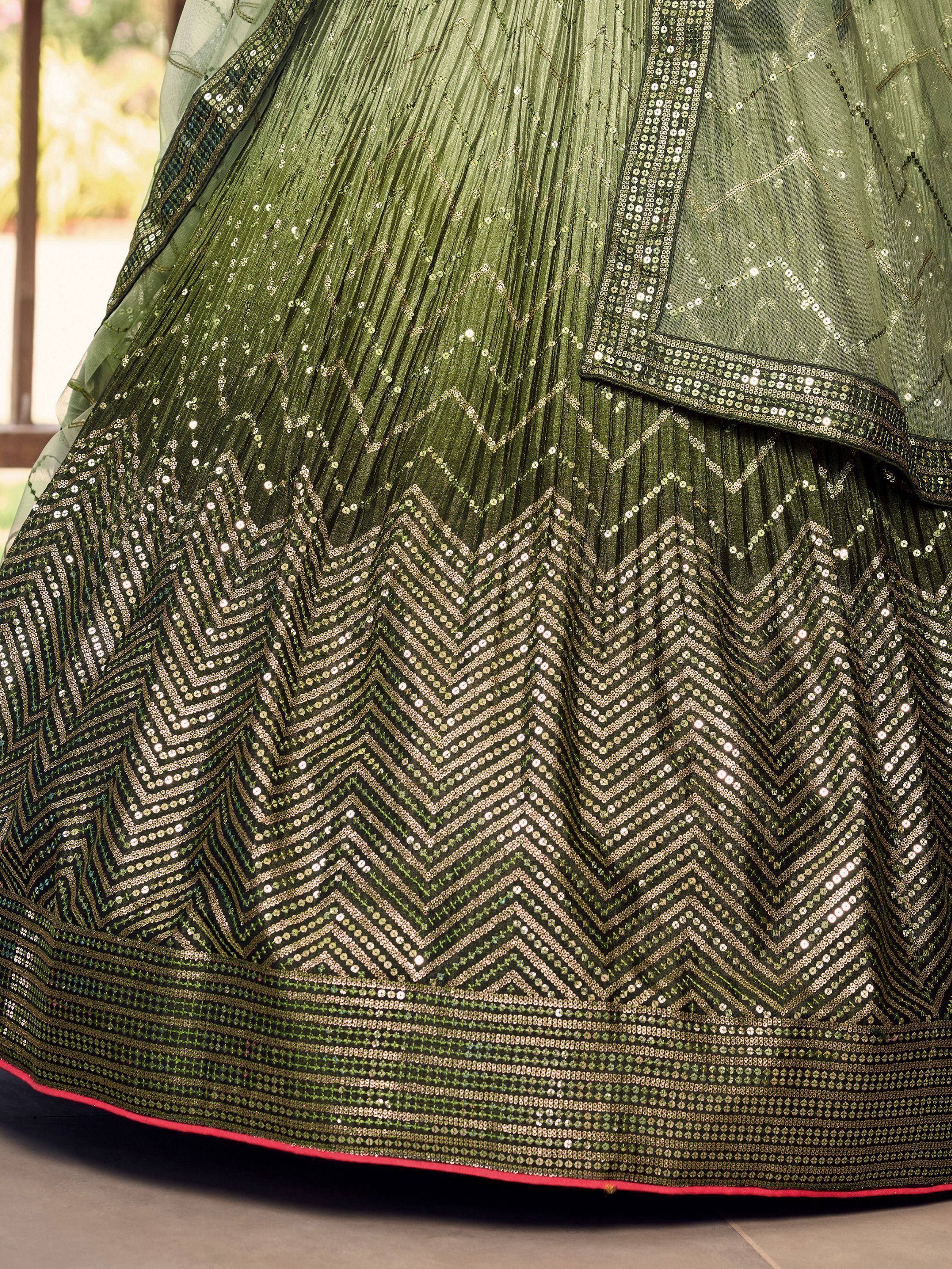 Olive green lehenga with intricate sequin chevron patterns and pleated skirt, ideal for Indian ethnic wear.