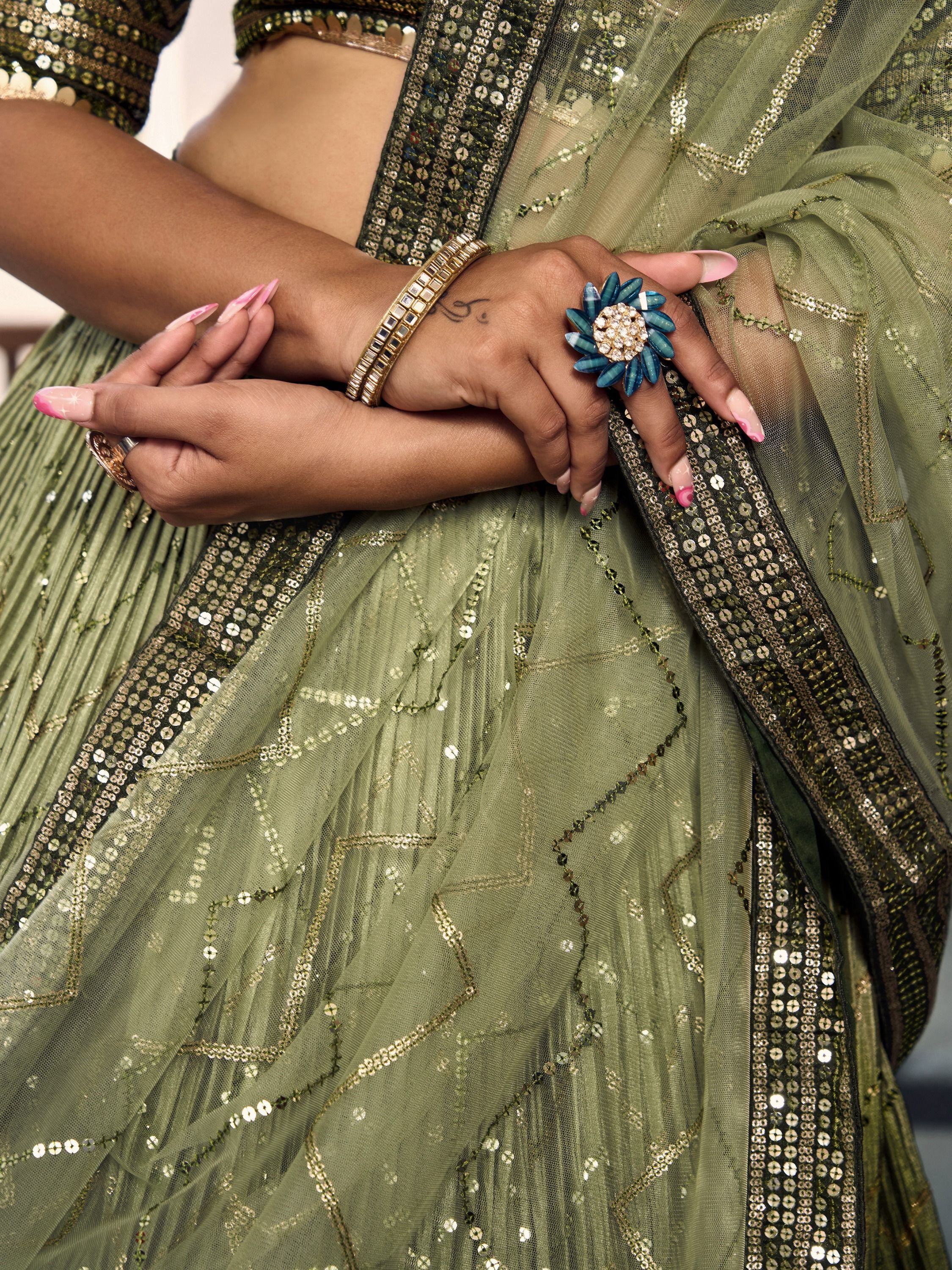 Olive green sequin lehenga choli with floral ring and bangles, Indian ethnic wear