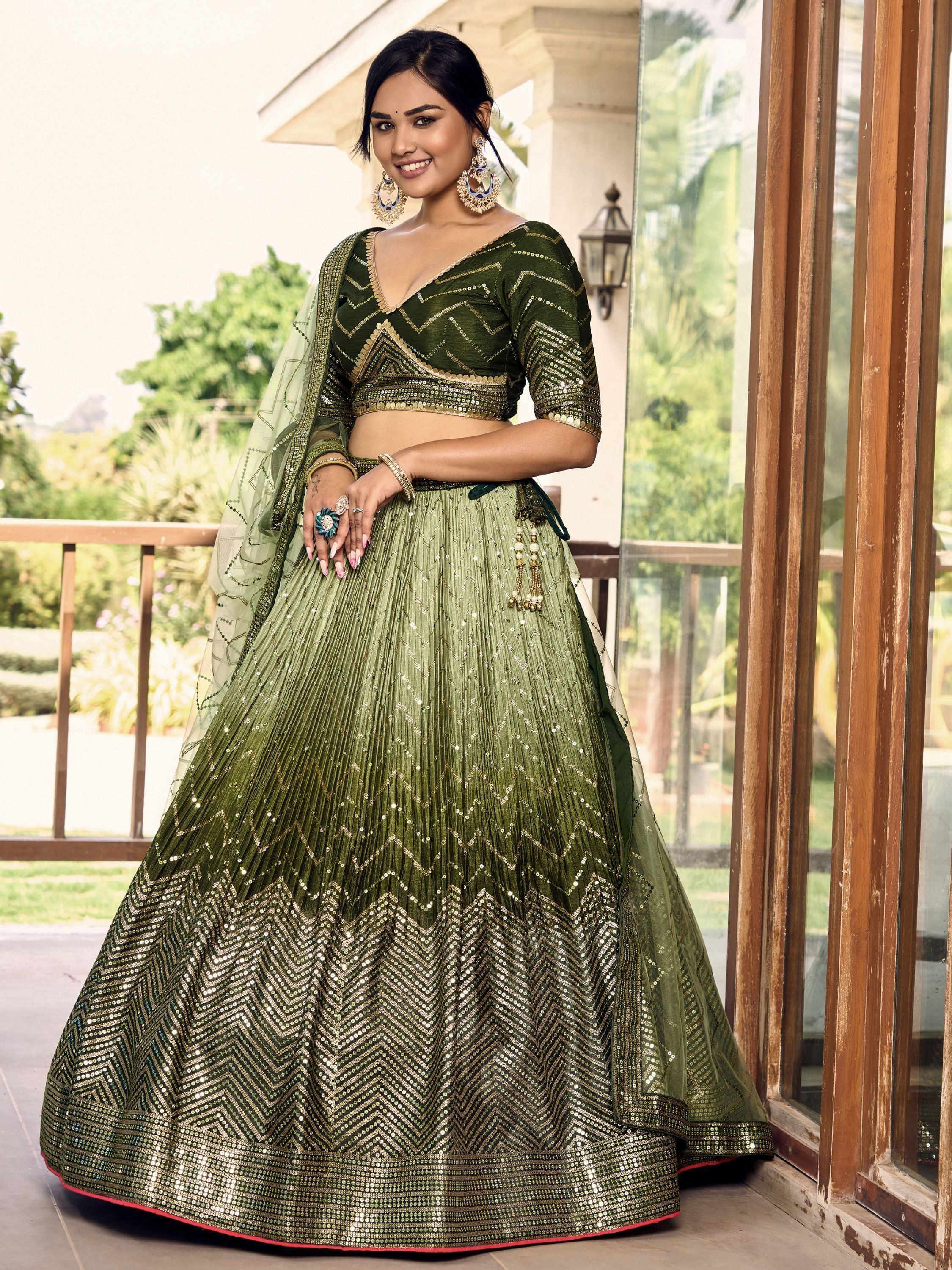 Green sequin lehenga choli with gold zigzag embroidery, perfect for Indian weddings and festive occasions.