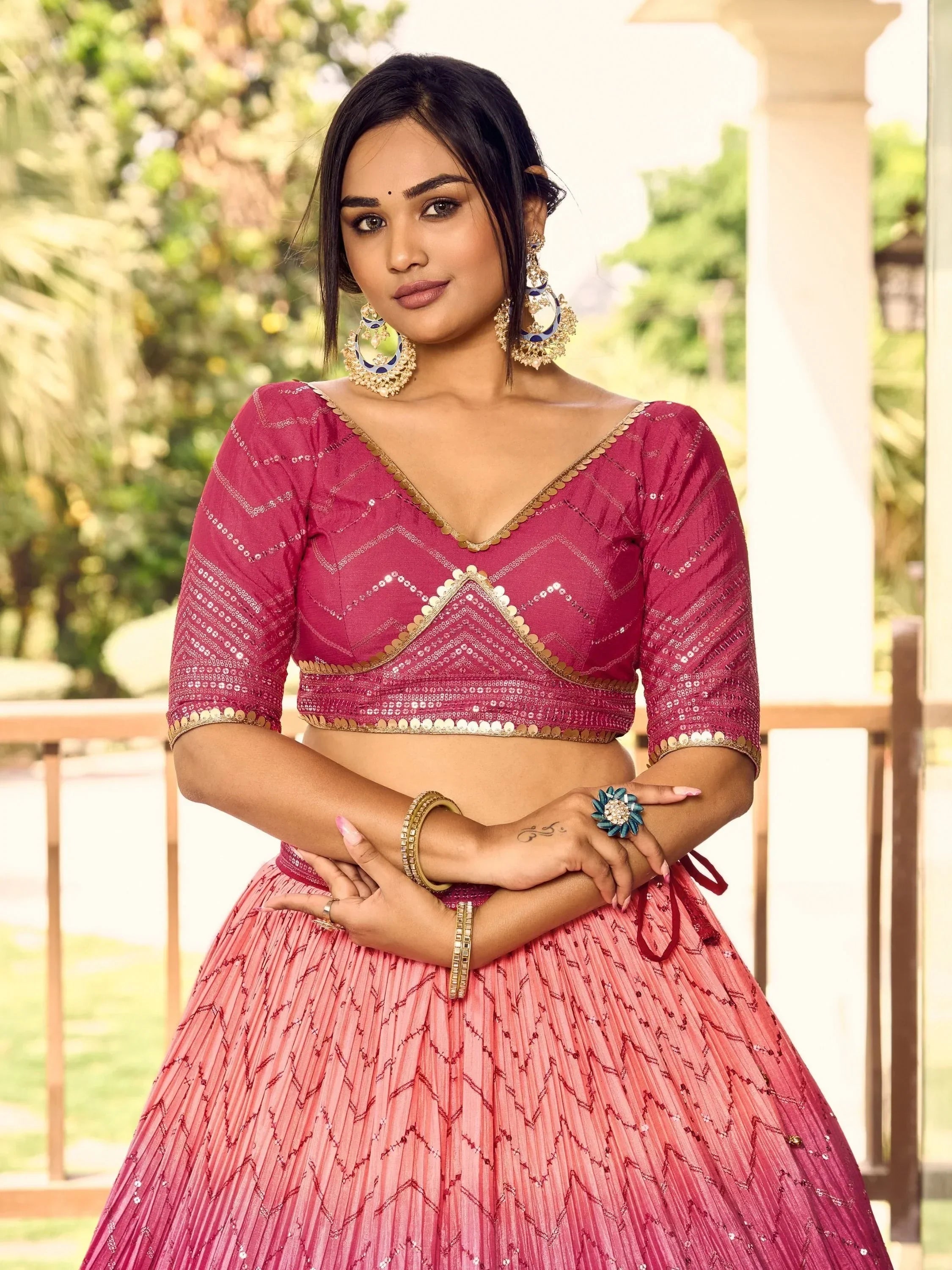 Pink sequin lehenga choli with gold trim, perfect for Indian ethnic wear and festive occasions.