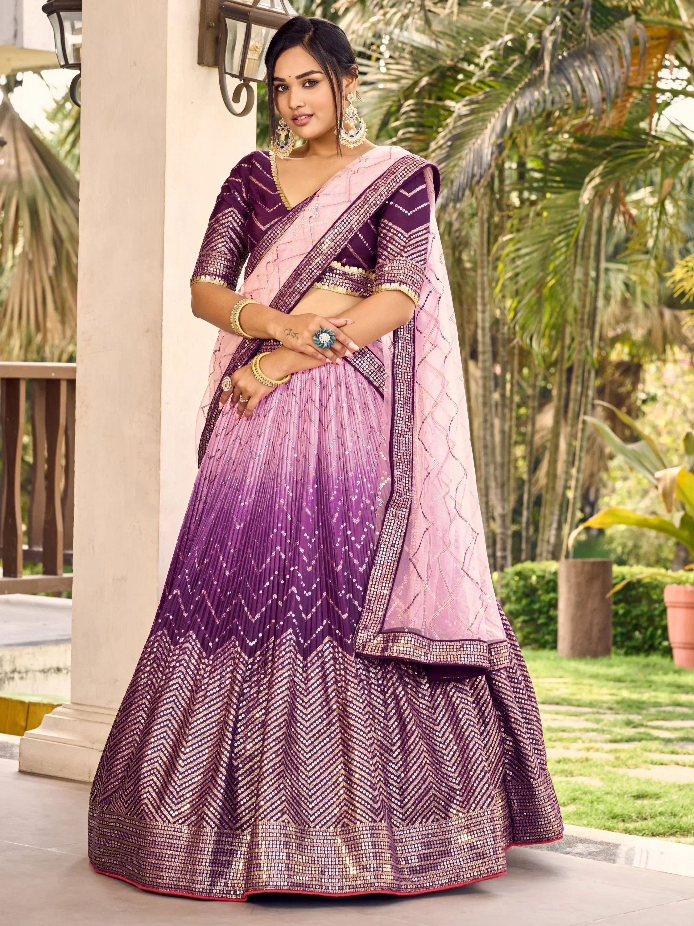 Purple and pink sequined lehenga choli with geometric patterns, perfect for Indian ethnic occasions