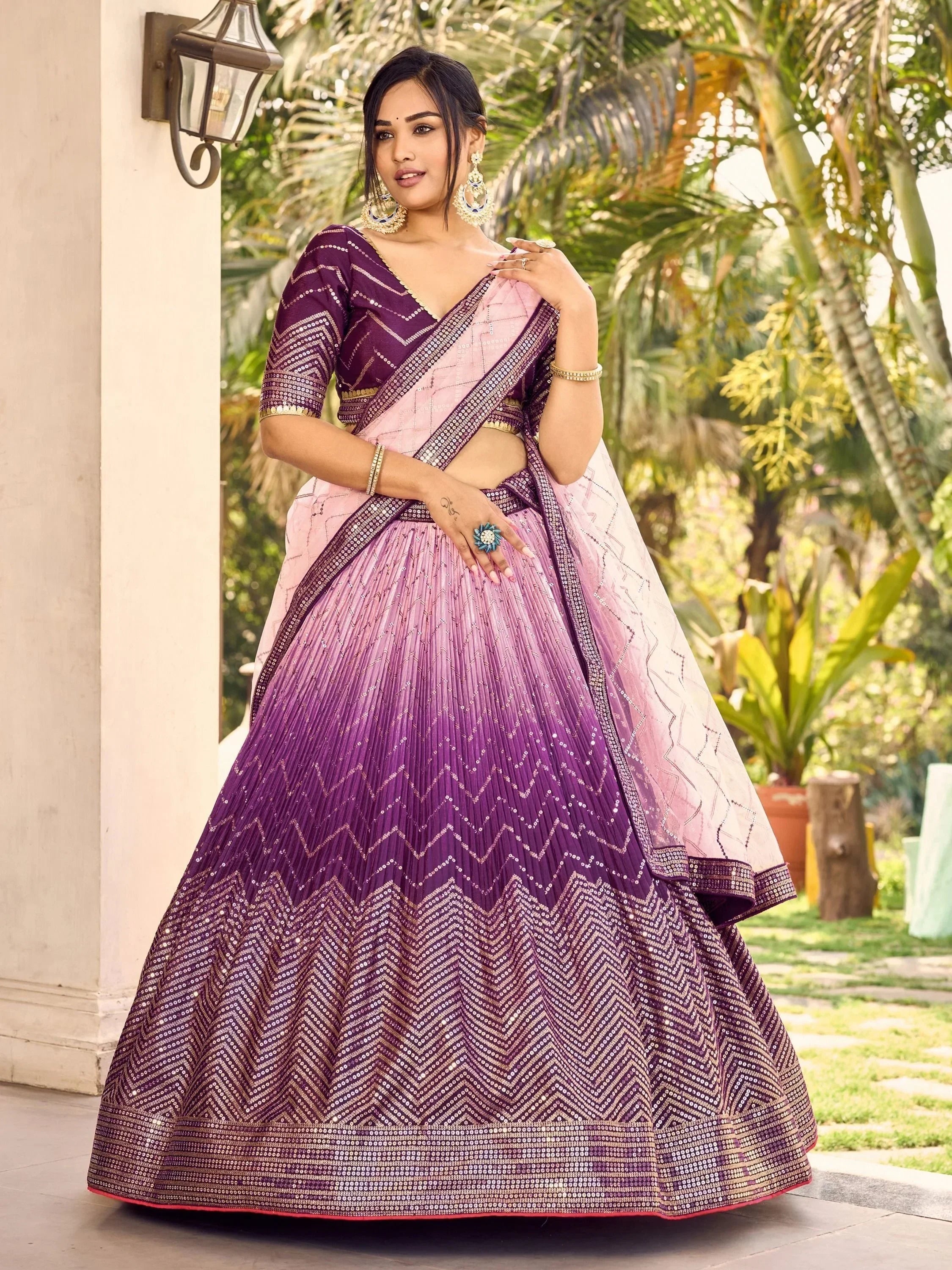 Purple and pink designer lehenga choli with sequin zigzag patterns, perfect for Indian ethnic occasions.