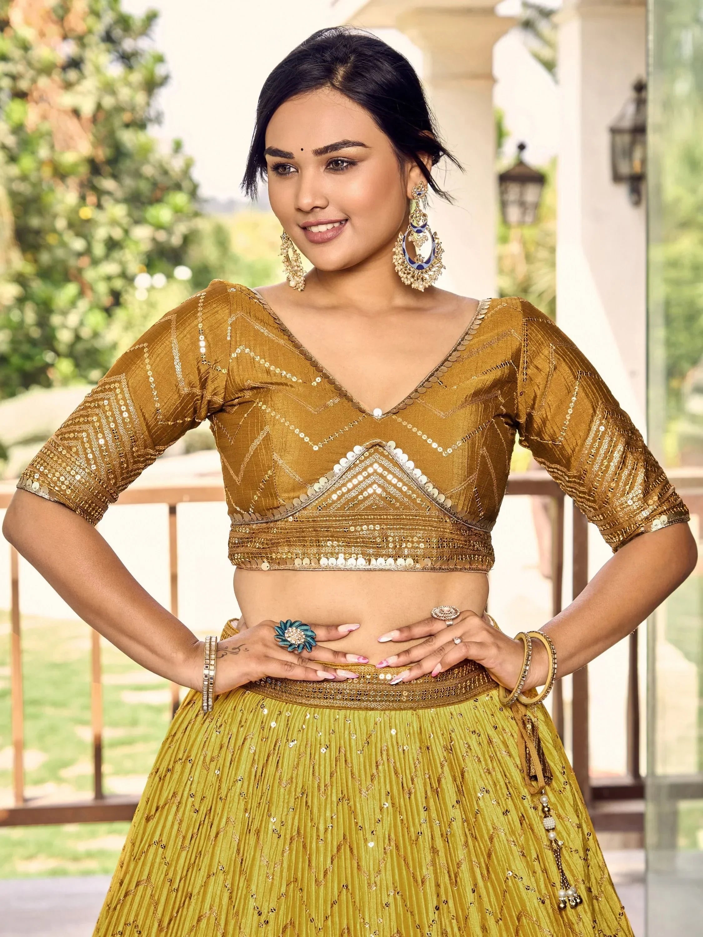 Golden sequined lehenga choli with V-neck blouse, perfect for Indian weddings and festive occasions