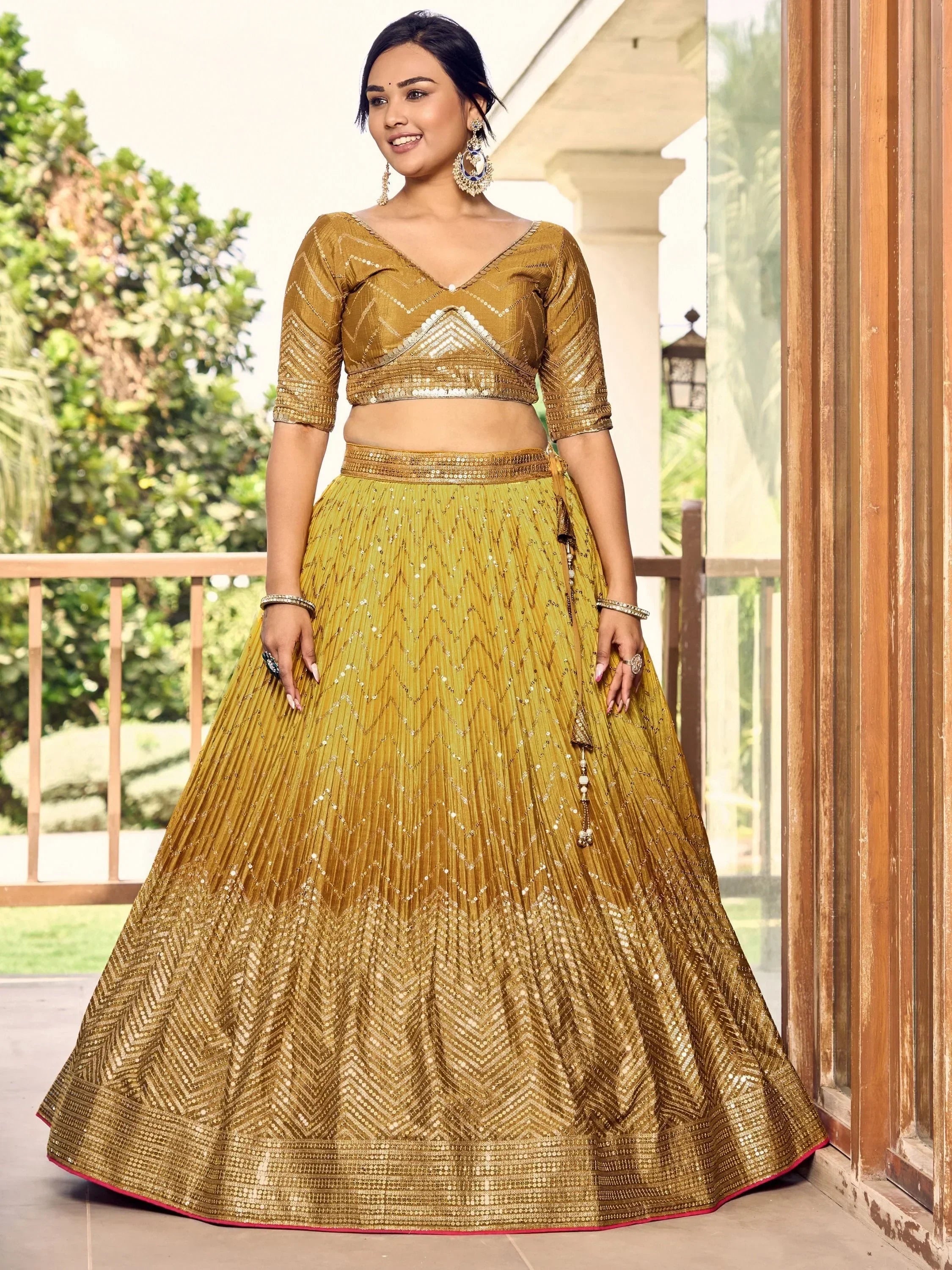 Golden sequin lehenga choli with chevron pattern, perfect for Indian ethnic wear and festive occasions