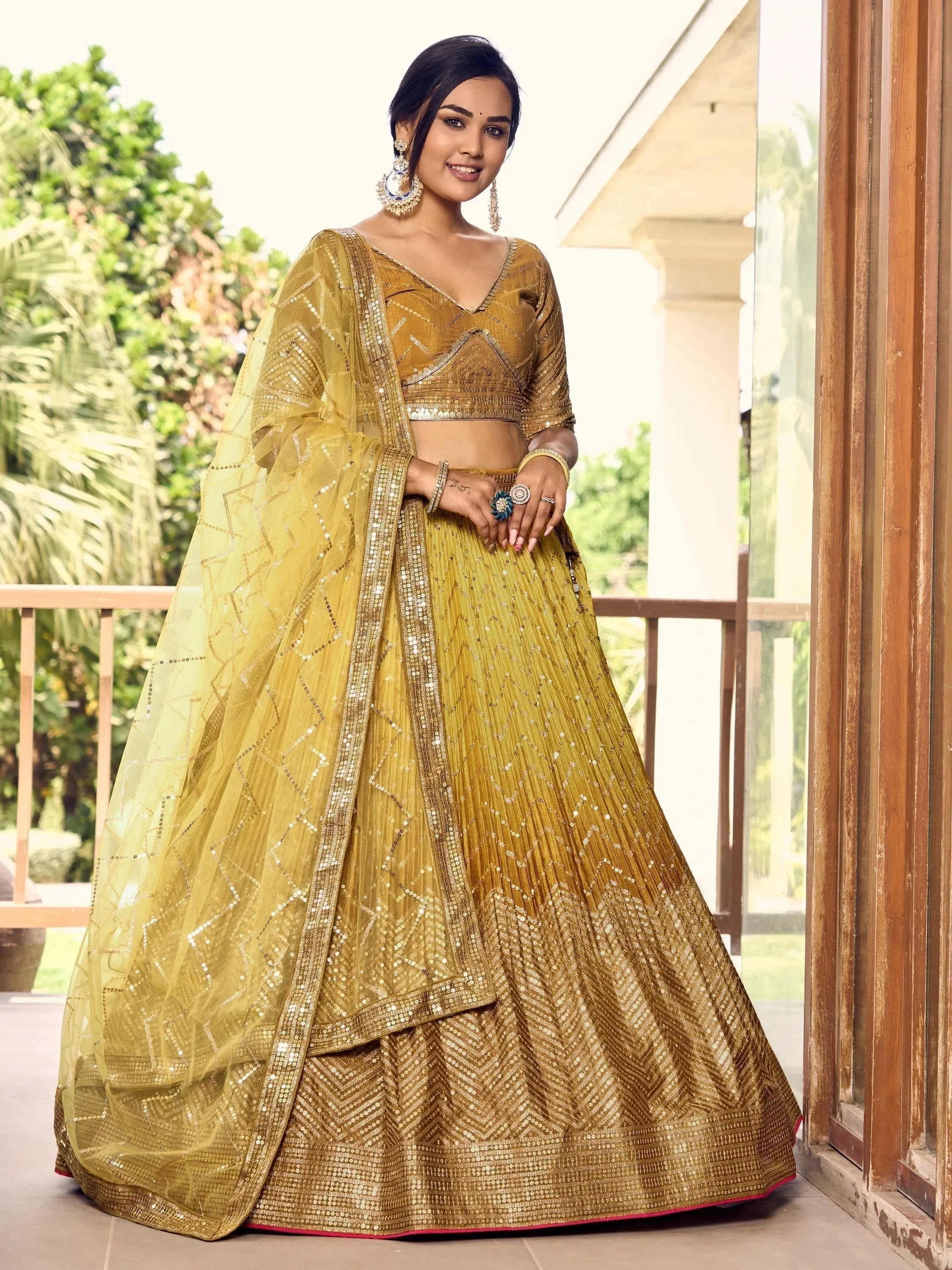 Golden designer lehenga choli with sequin work, perfect for Indian weddings and festive occasions