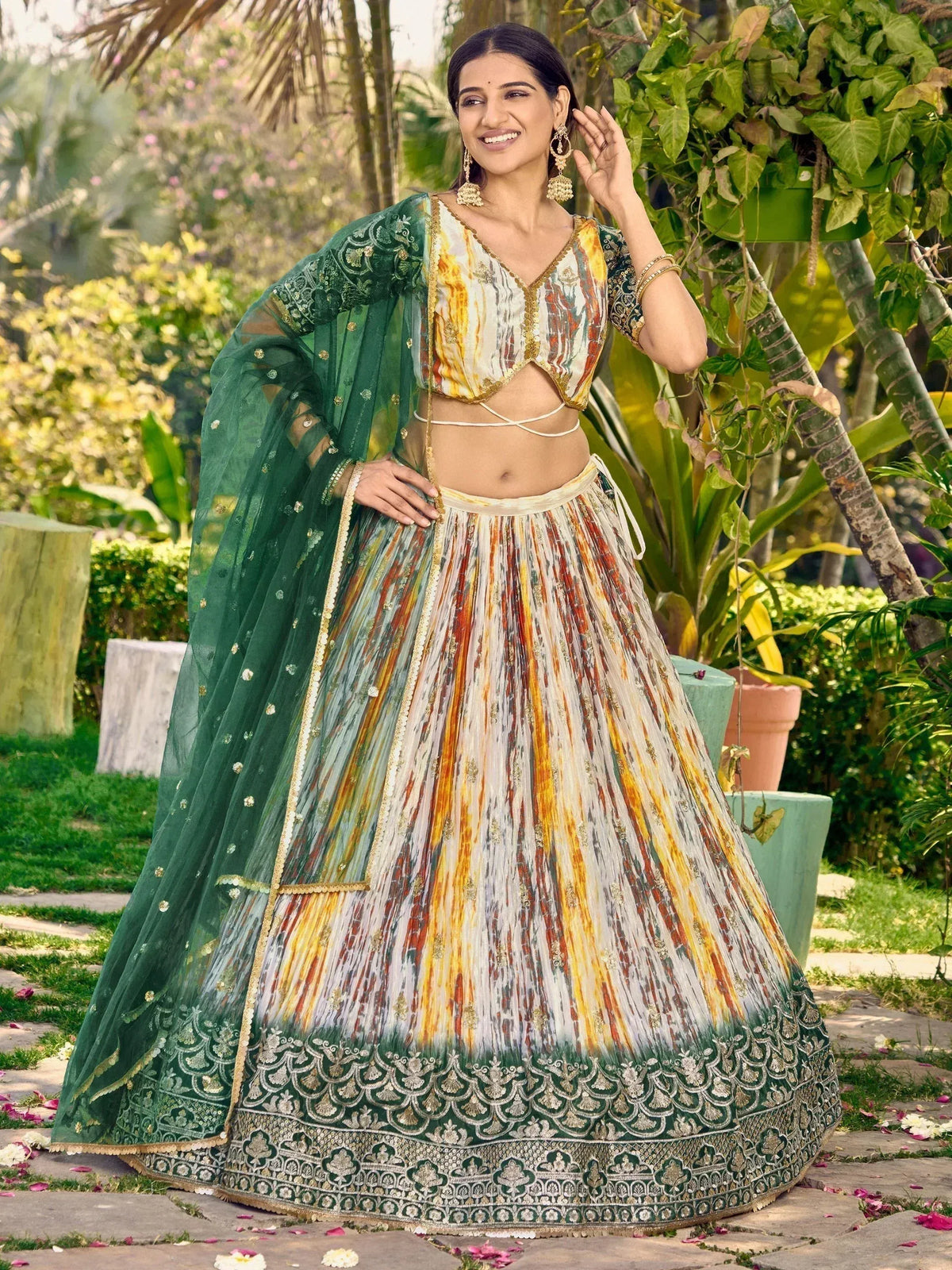 Woman in vibrant designer lehenga choli with green dupatta, perfect for Indian ethnic occasions