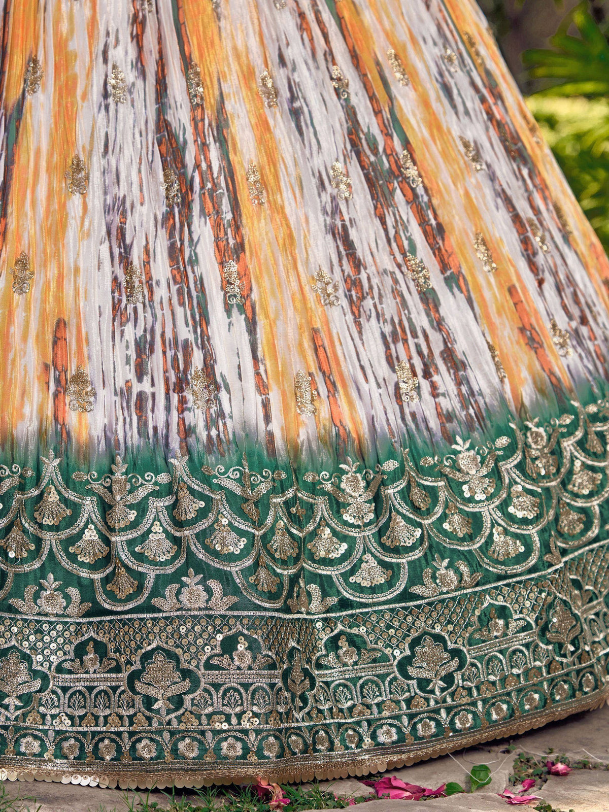 Designer lehenga skirt with ombre print and gold embroidery, perfect for Indian ethnic wear occasions.