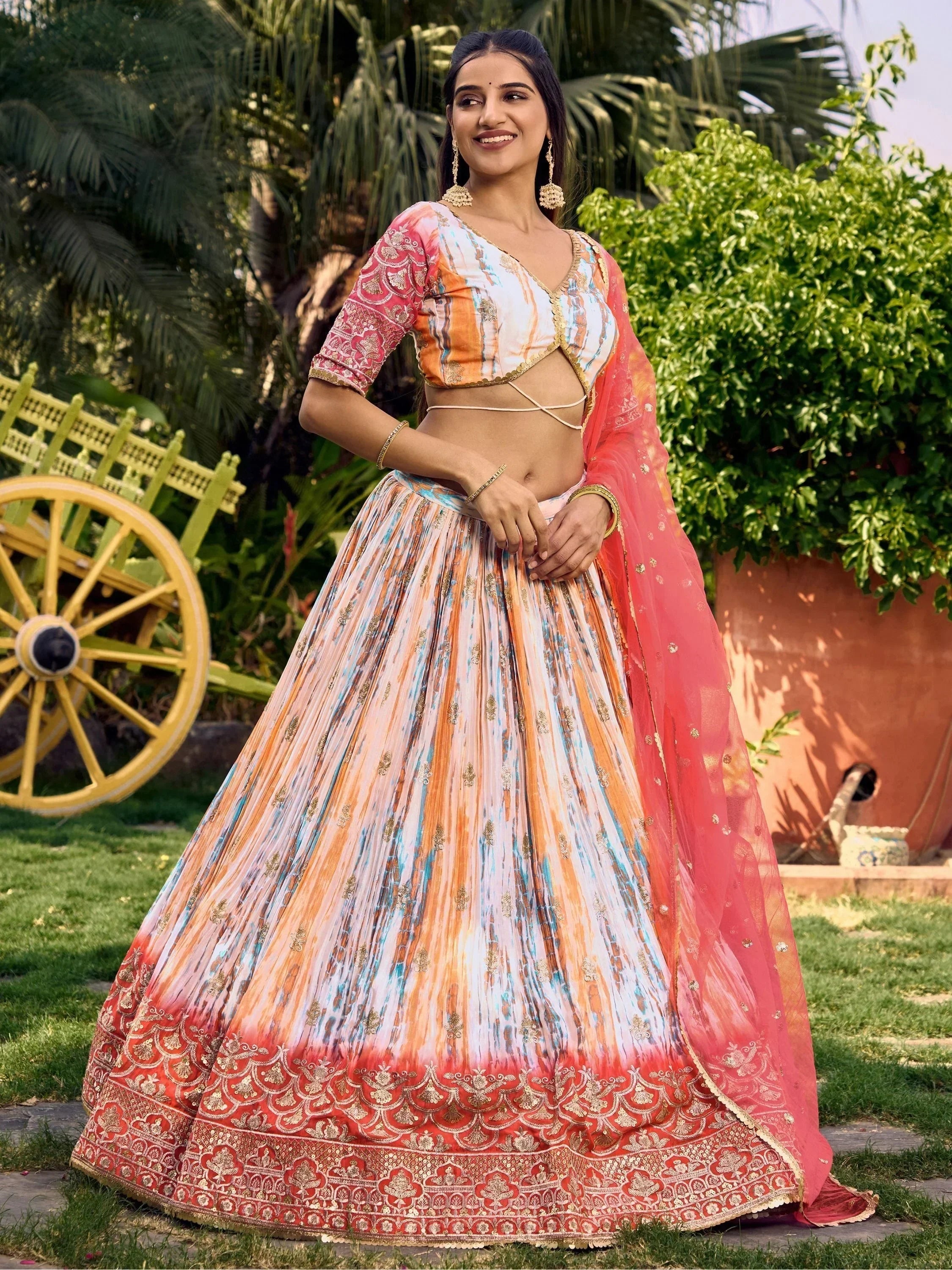 Colorful printed lehenga choli with gold embroidery, perfect for Indian ethnic wear and festive occasions.