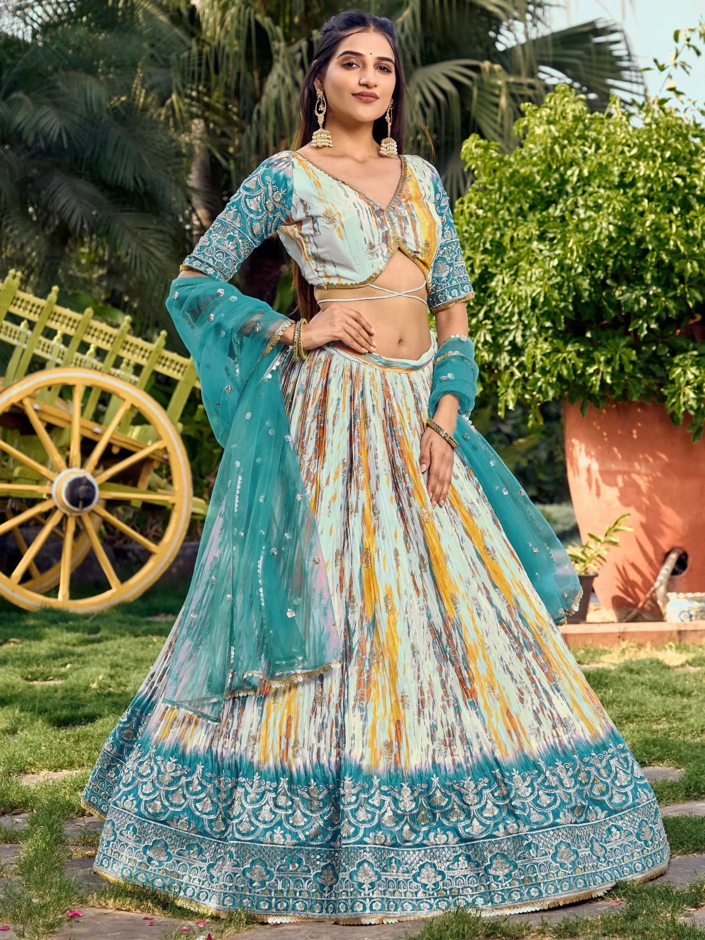 Teal and gold embroidered lehenga choli with printed dupatta, perfect for Indian ethnic occasions