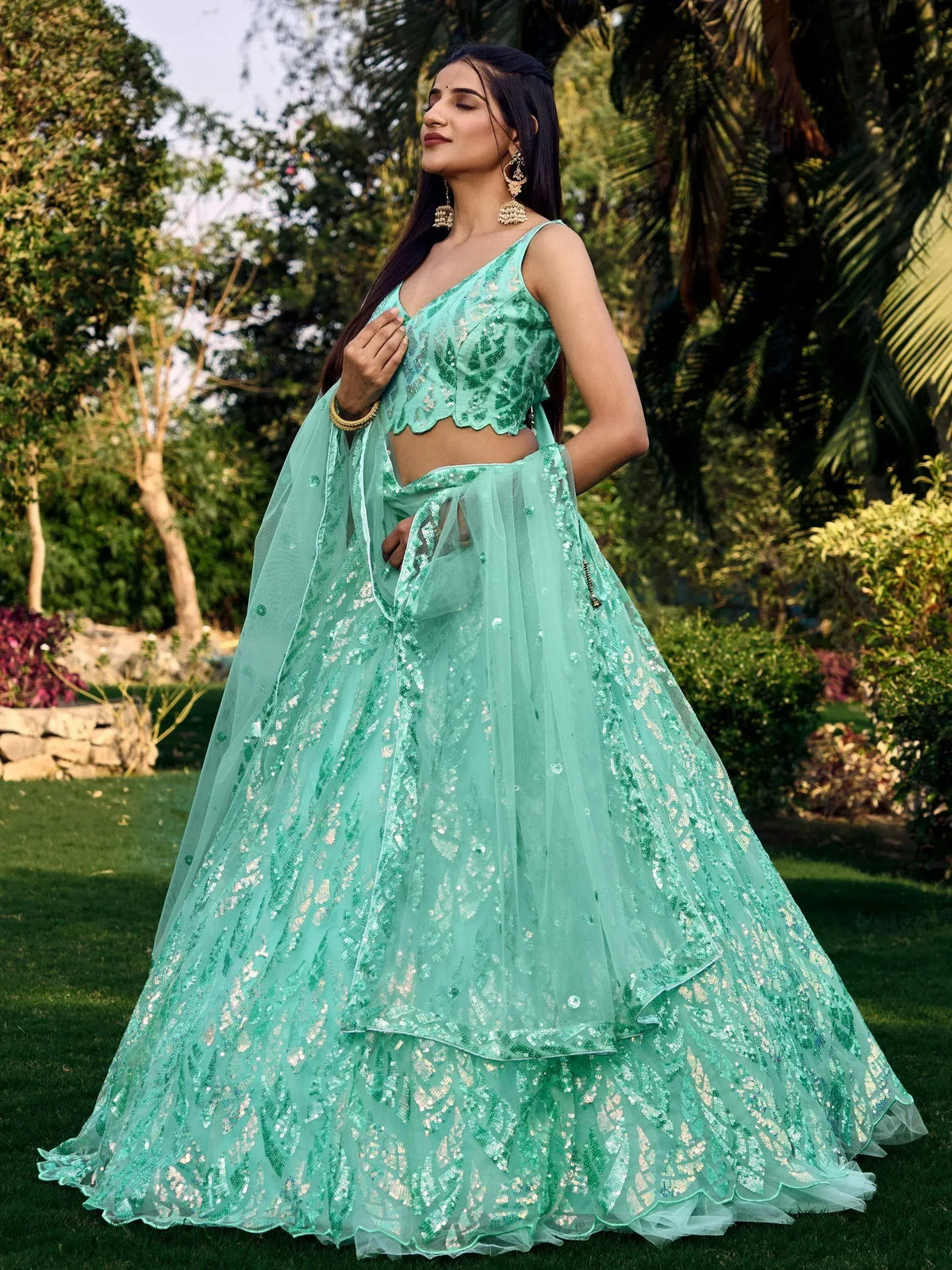 Mint green sequin lehenga choli with sheer dupatta, perfect for Indian ethnic wear events