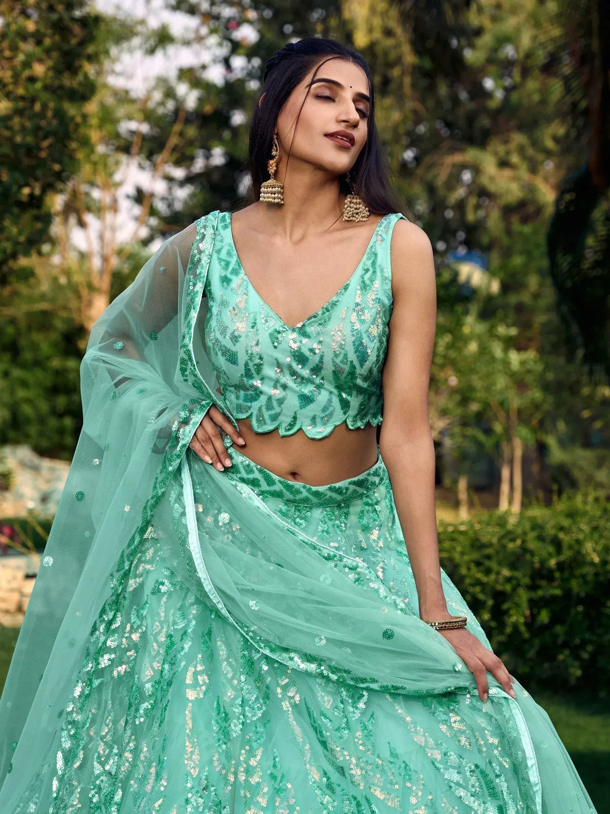 Mint green sequin lehenga choli with sheer dupatta, perfect for Indian ethnic wear events