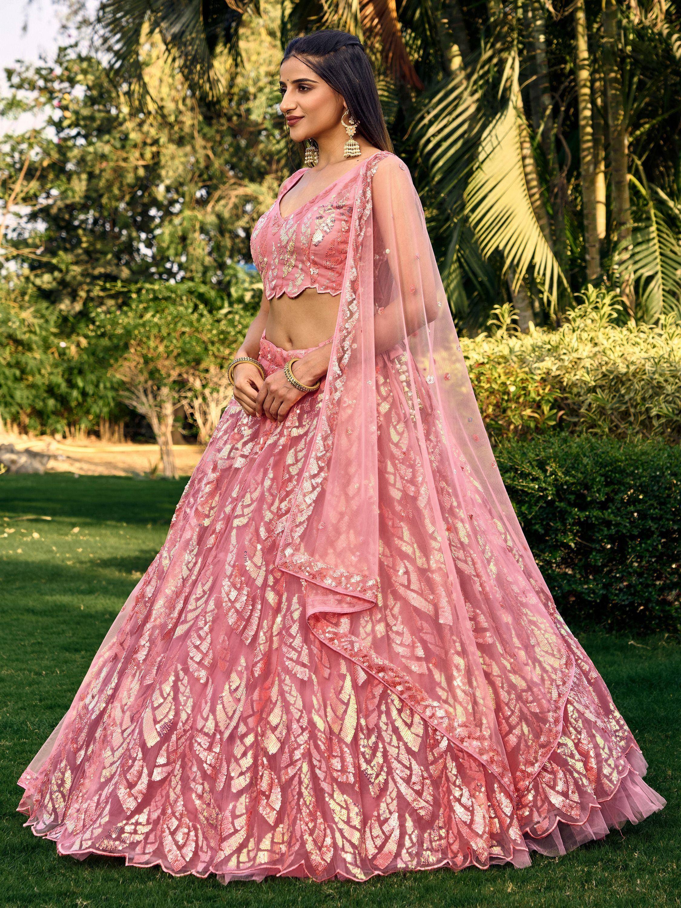 Pink designer lehenga choli with gold sequin work, perfect for Indian weddings and festive occasions