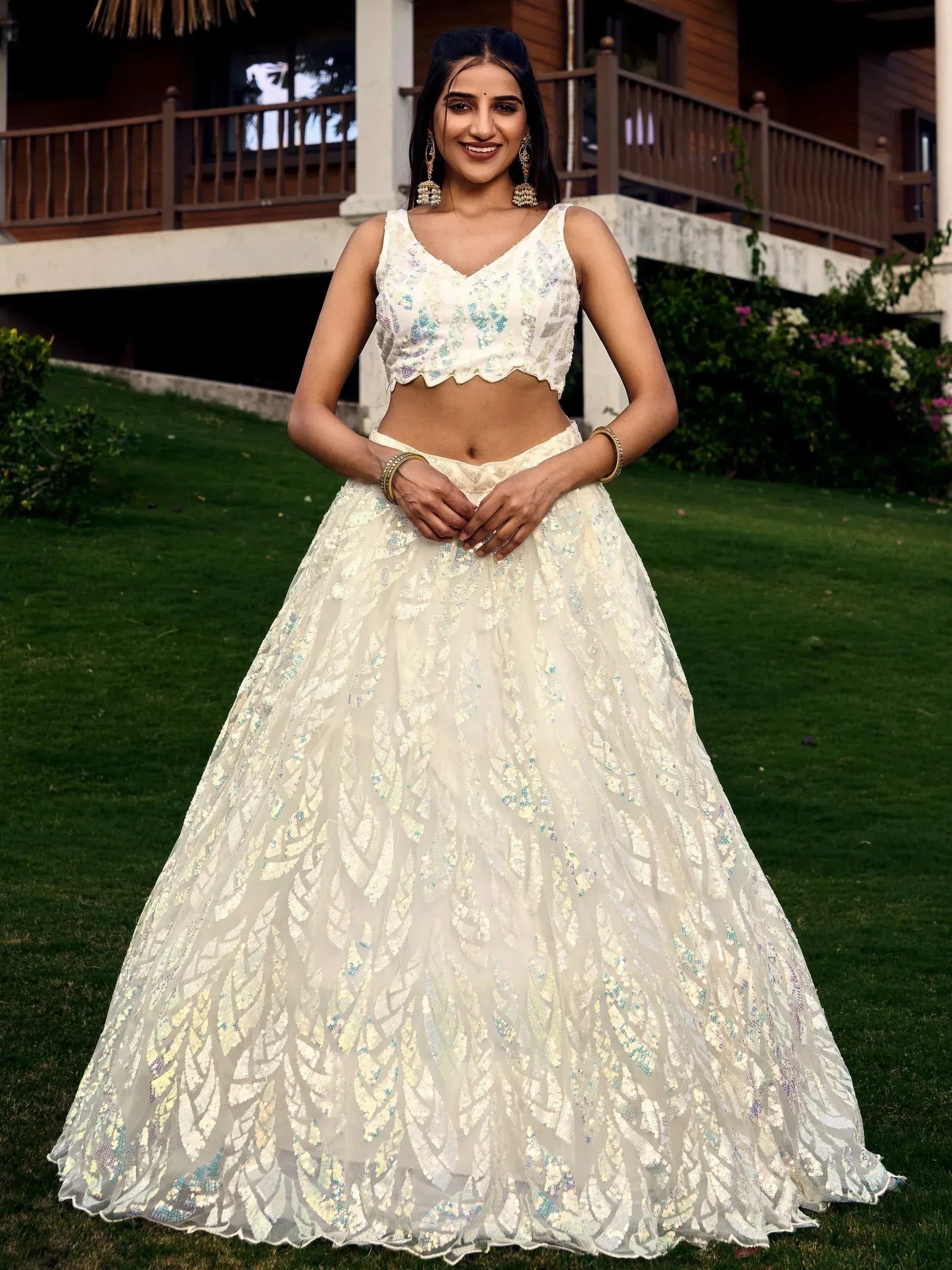 Elegant white lehenga choli with sequin embroidery, perfect for Indian ethnic occasions