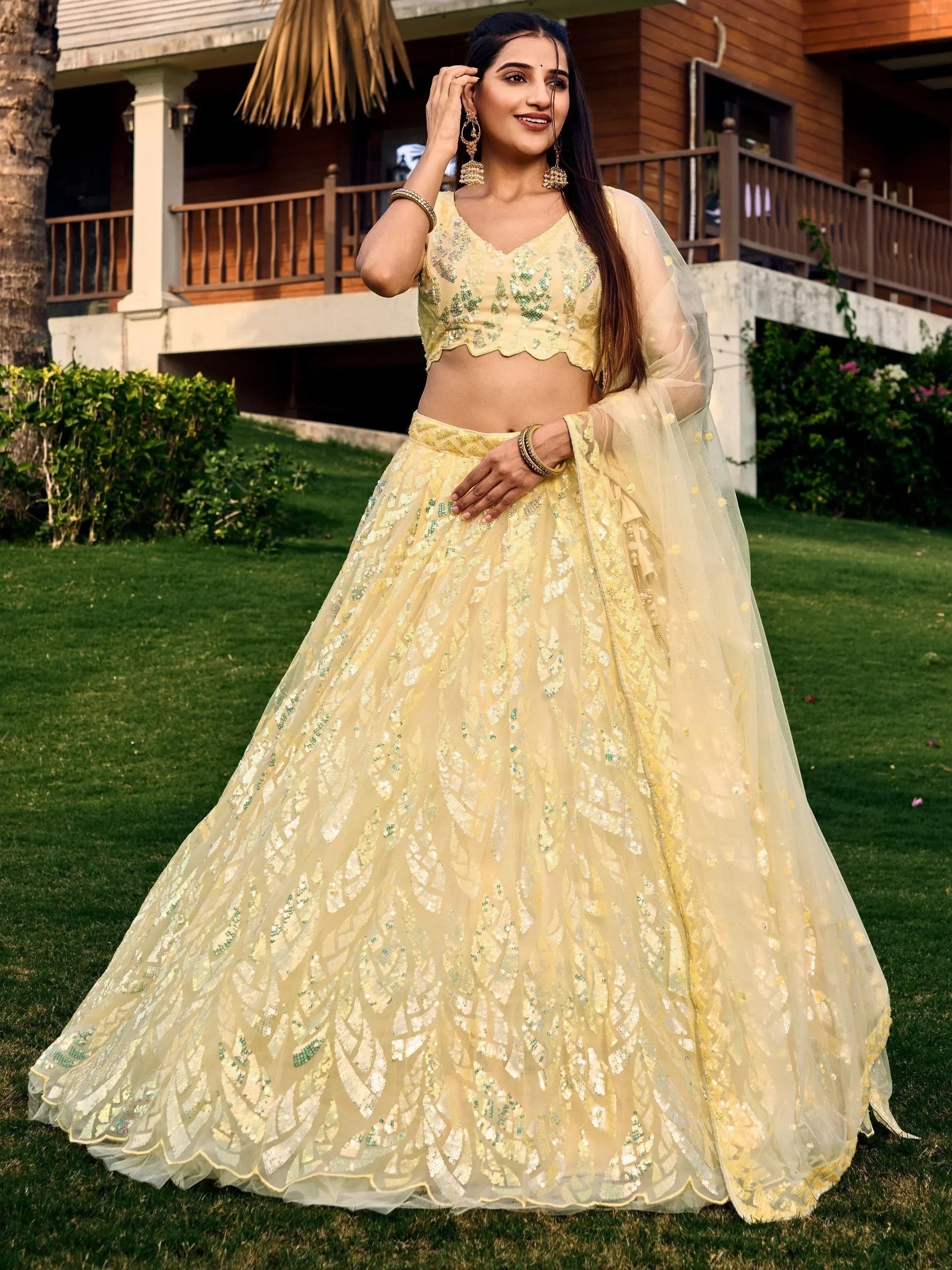 Yellow sequin lehenga choli with green embroidery, perfect for Indian ethnic wear events
