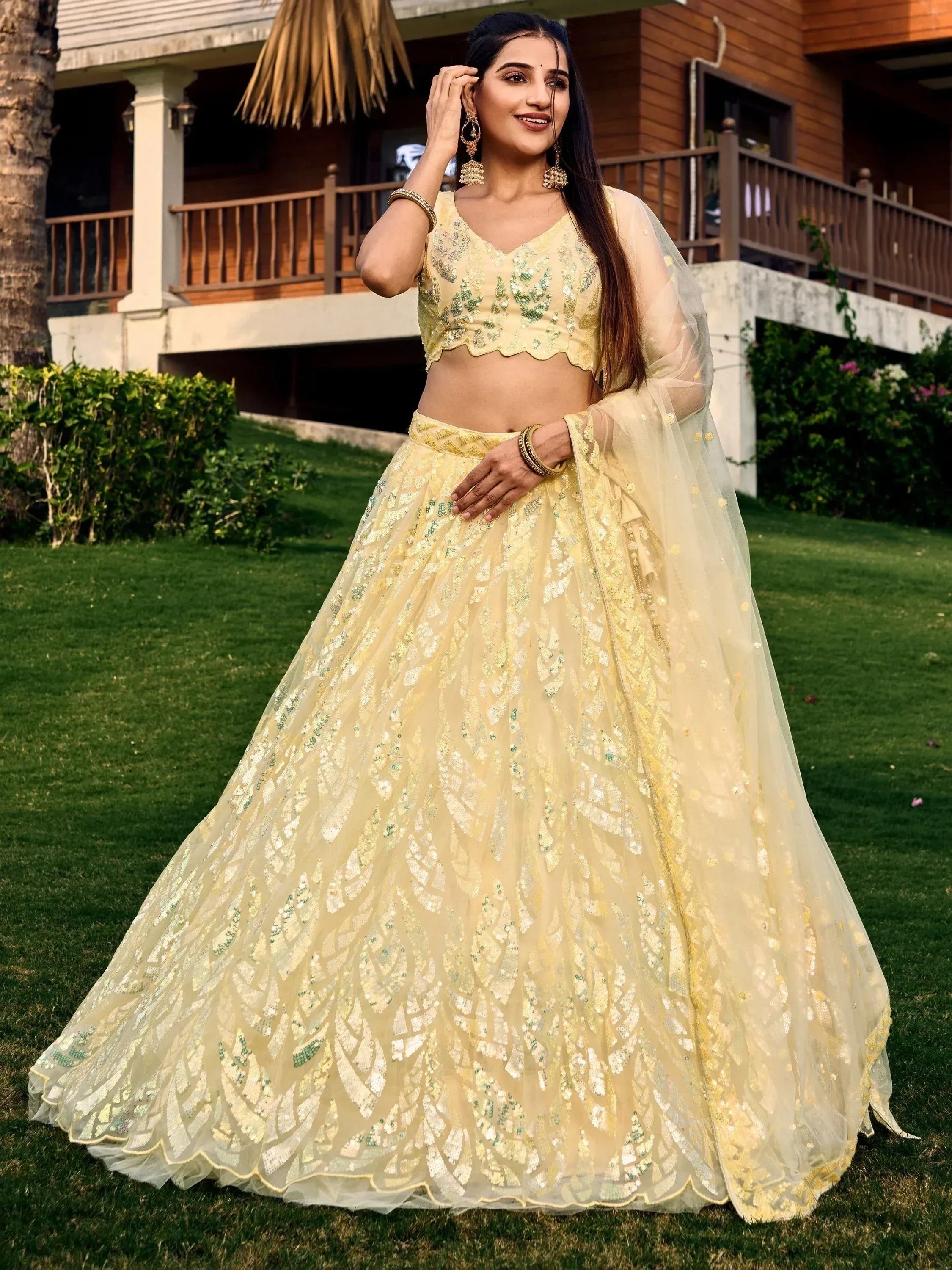 Yellow sequin lehenga choli with green embroidery, perfect for Indian ethnic wear events