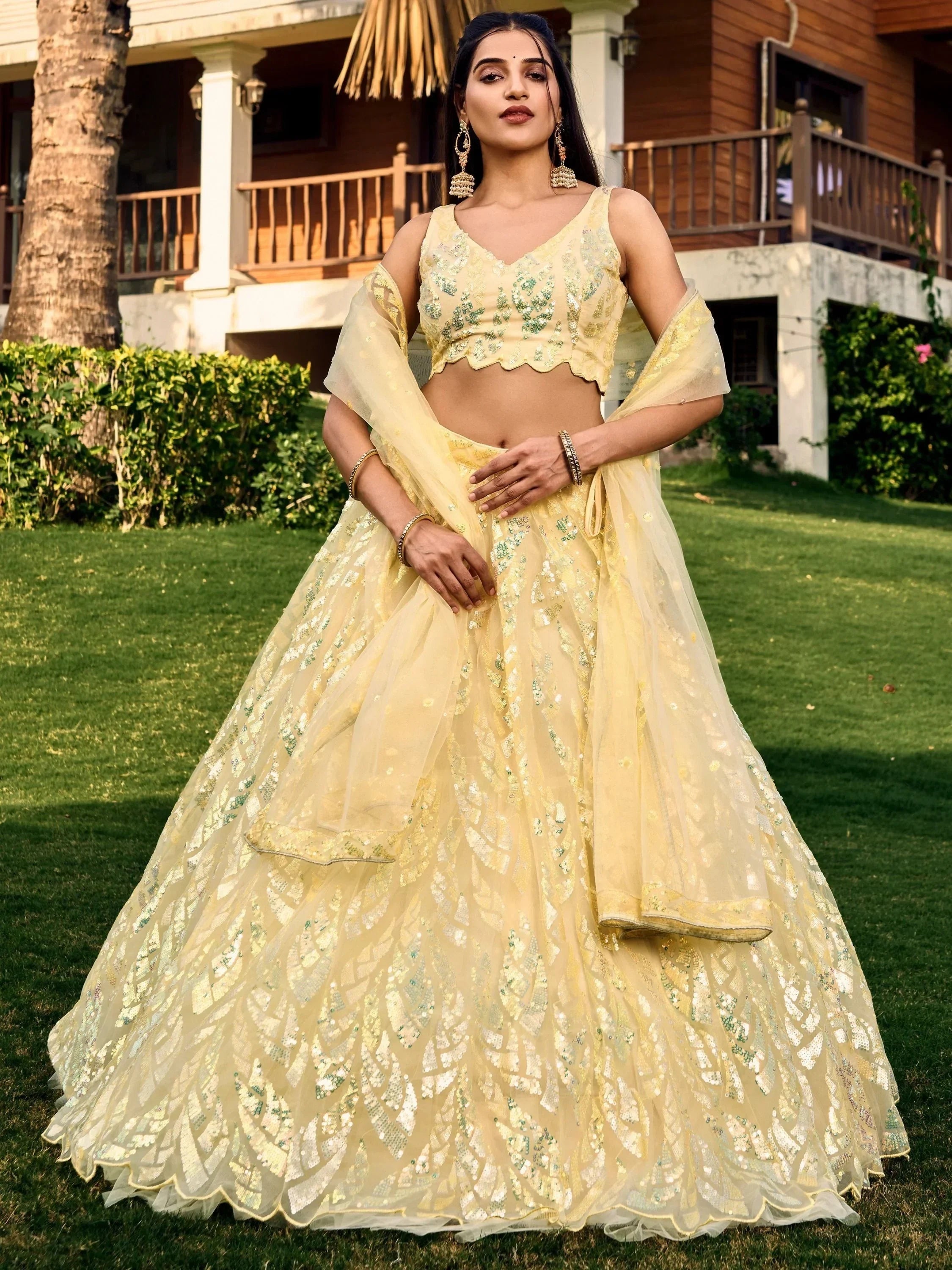 Yellow sequin lehenga choli with sheer dupatta, perfect for Indian ethnic wear events