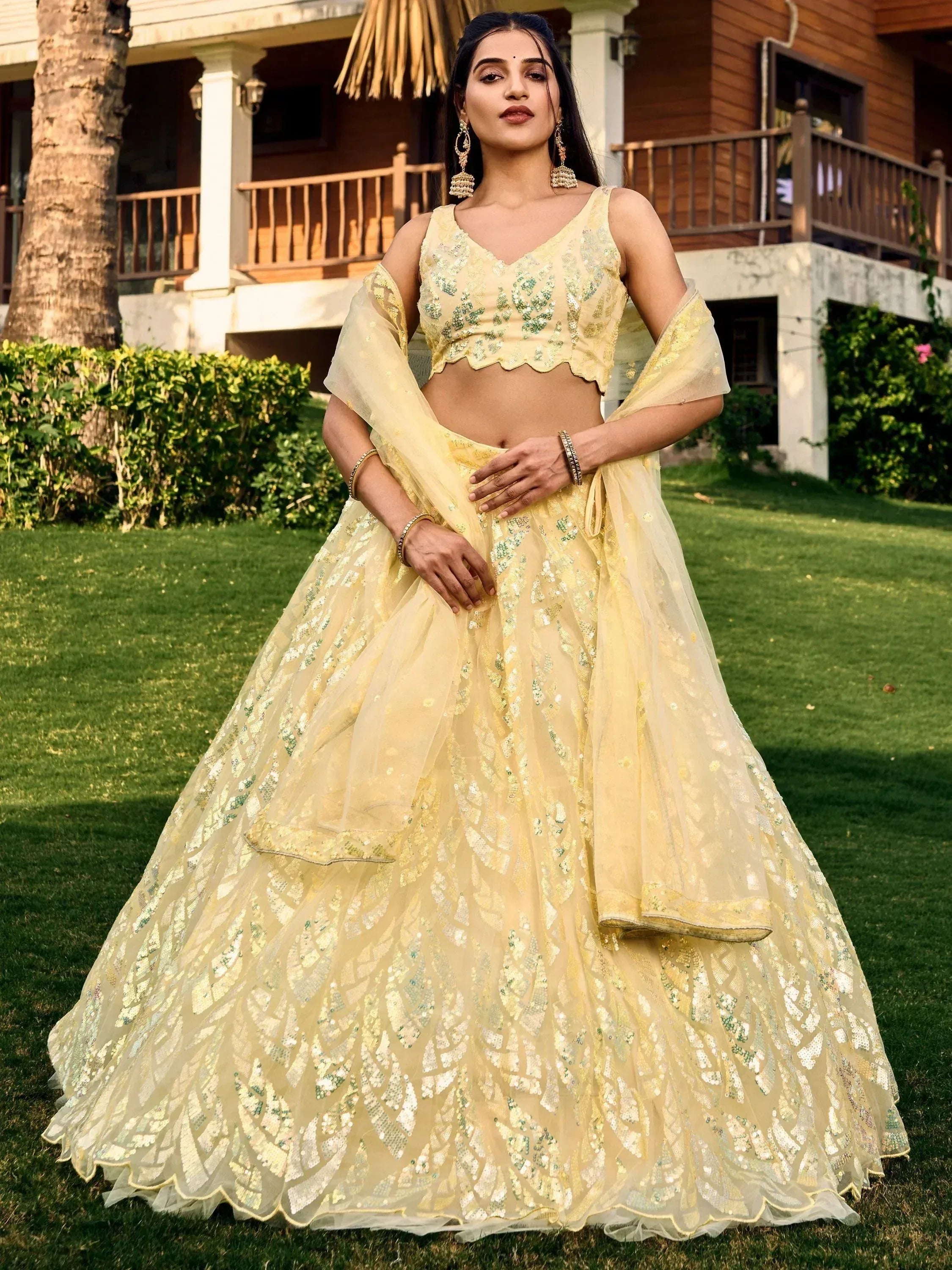 Yellow sequin lehenga choli with sheer dupatta, perfect for Indian ethnic wear events