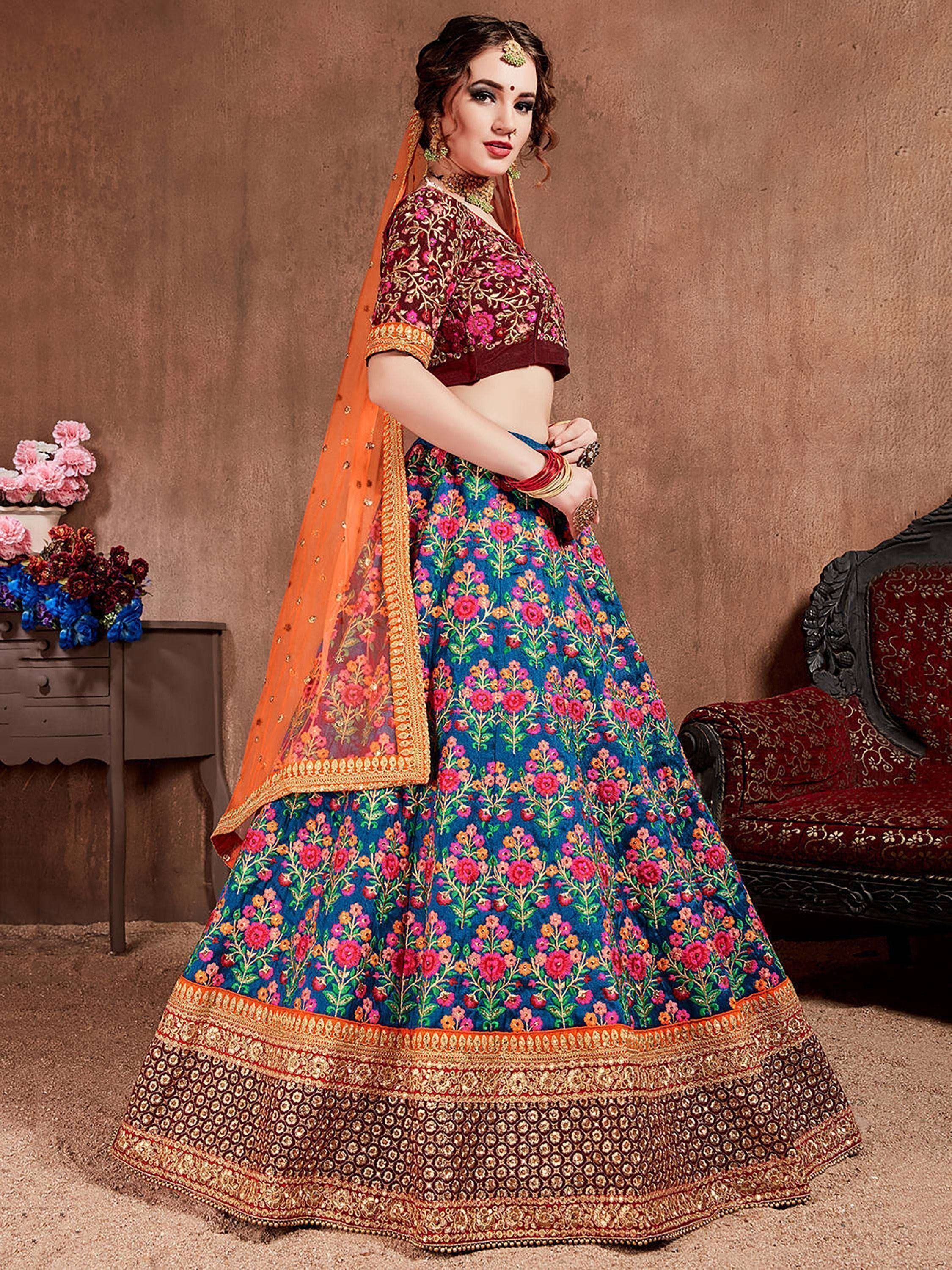 Designer lehenga choli with floral embroidery, vibrant colors, and orange dupatta for Indian ethnic wear