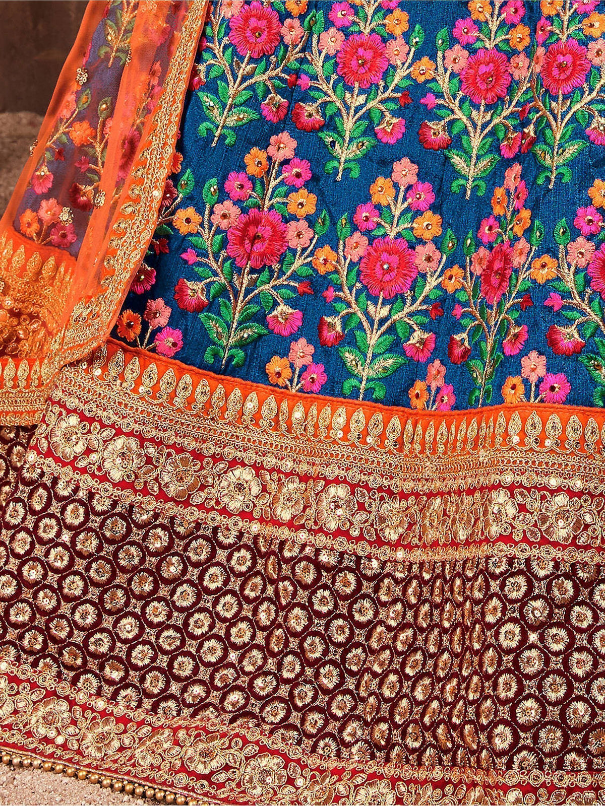 Blue and red embroidered lehenga choli with floral motifs and orange dupatta, Indian ethnic wear