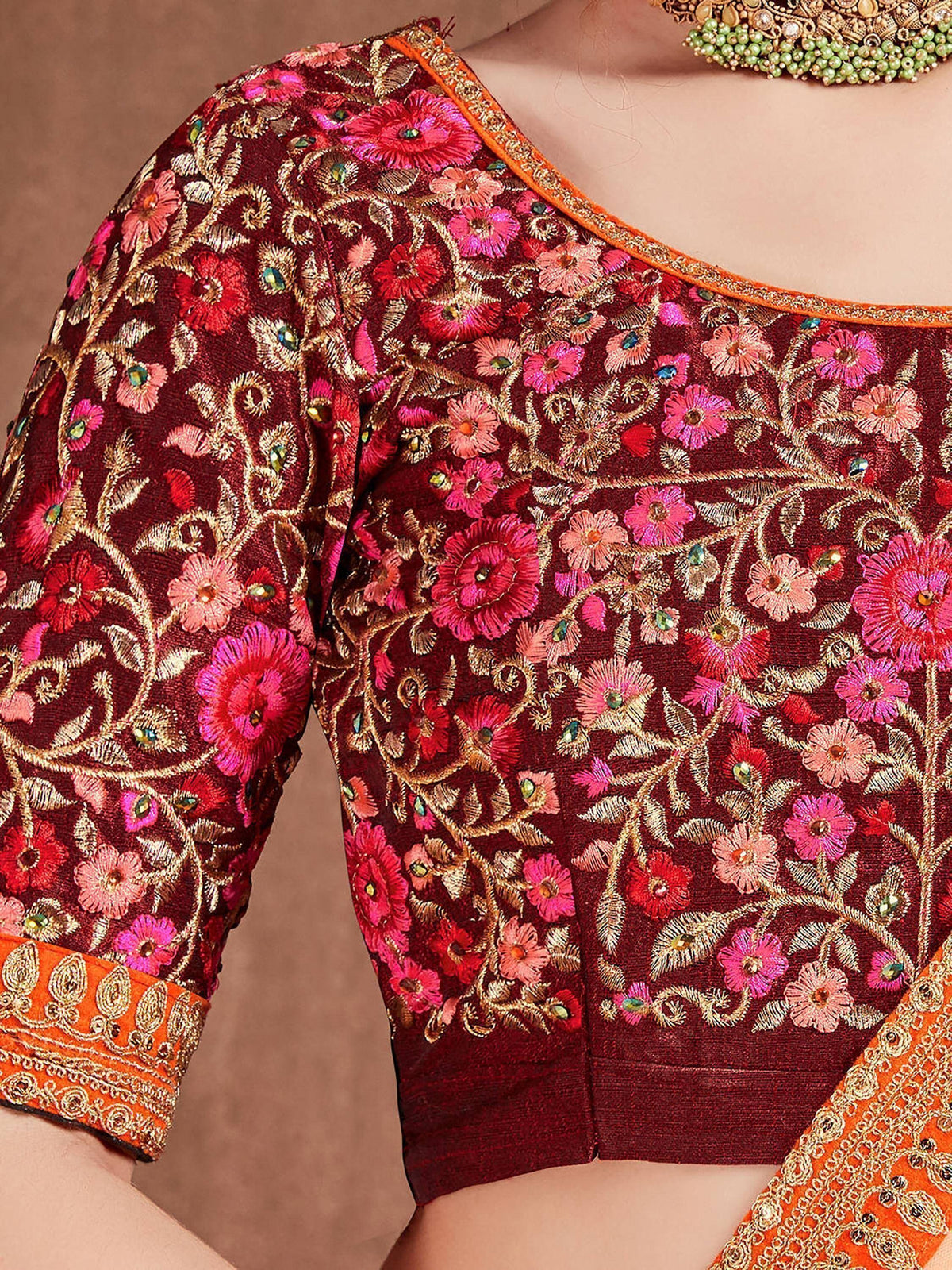 Maroon floral embroidered blouse with gold detailing, perfect for Indian ethnic wear