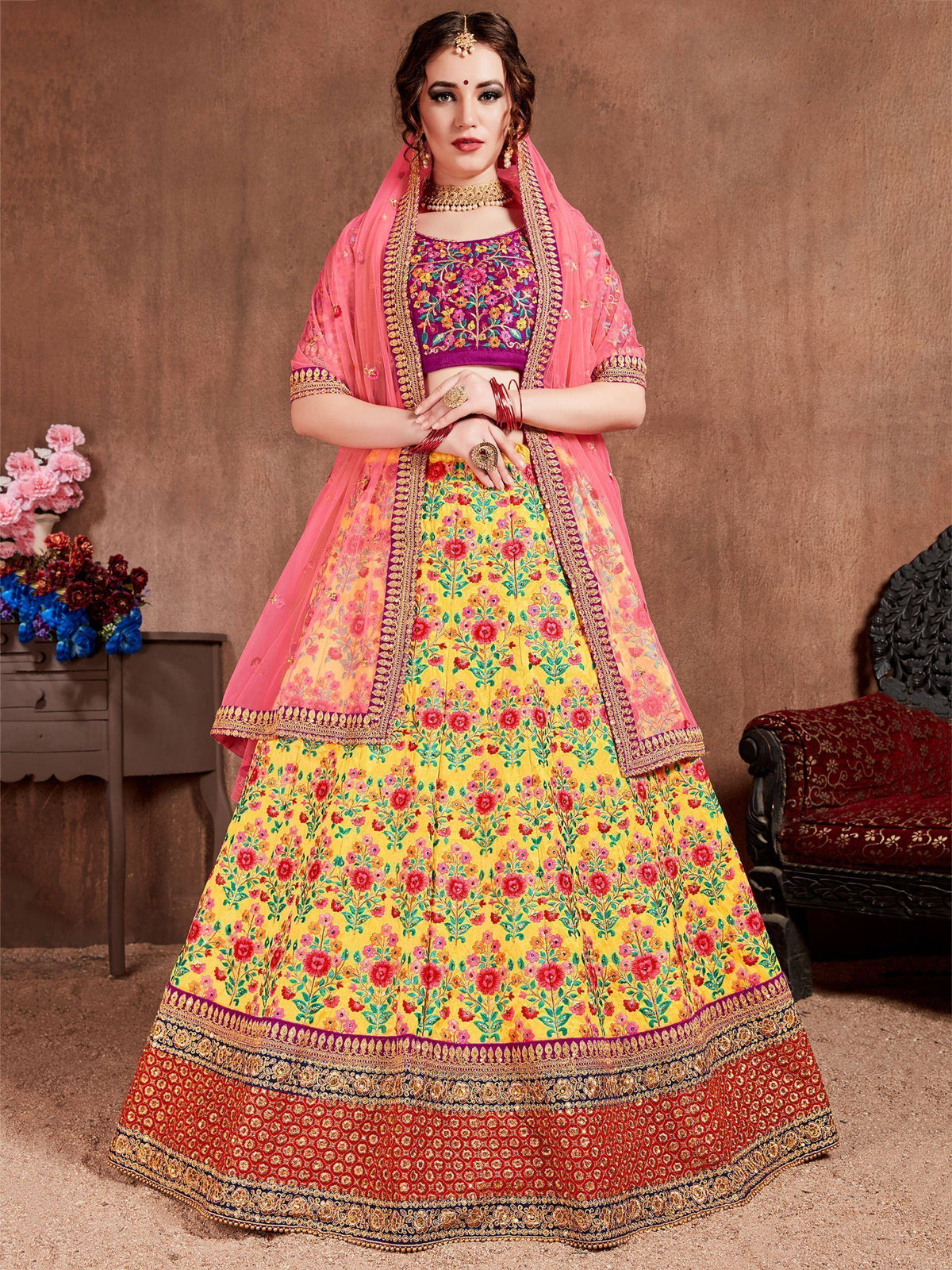Vibrant floral lehenga choli with pink dupatta, perfect for Indian weddings and festive occasions