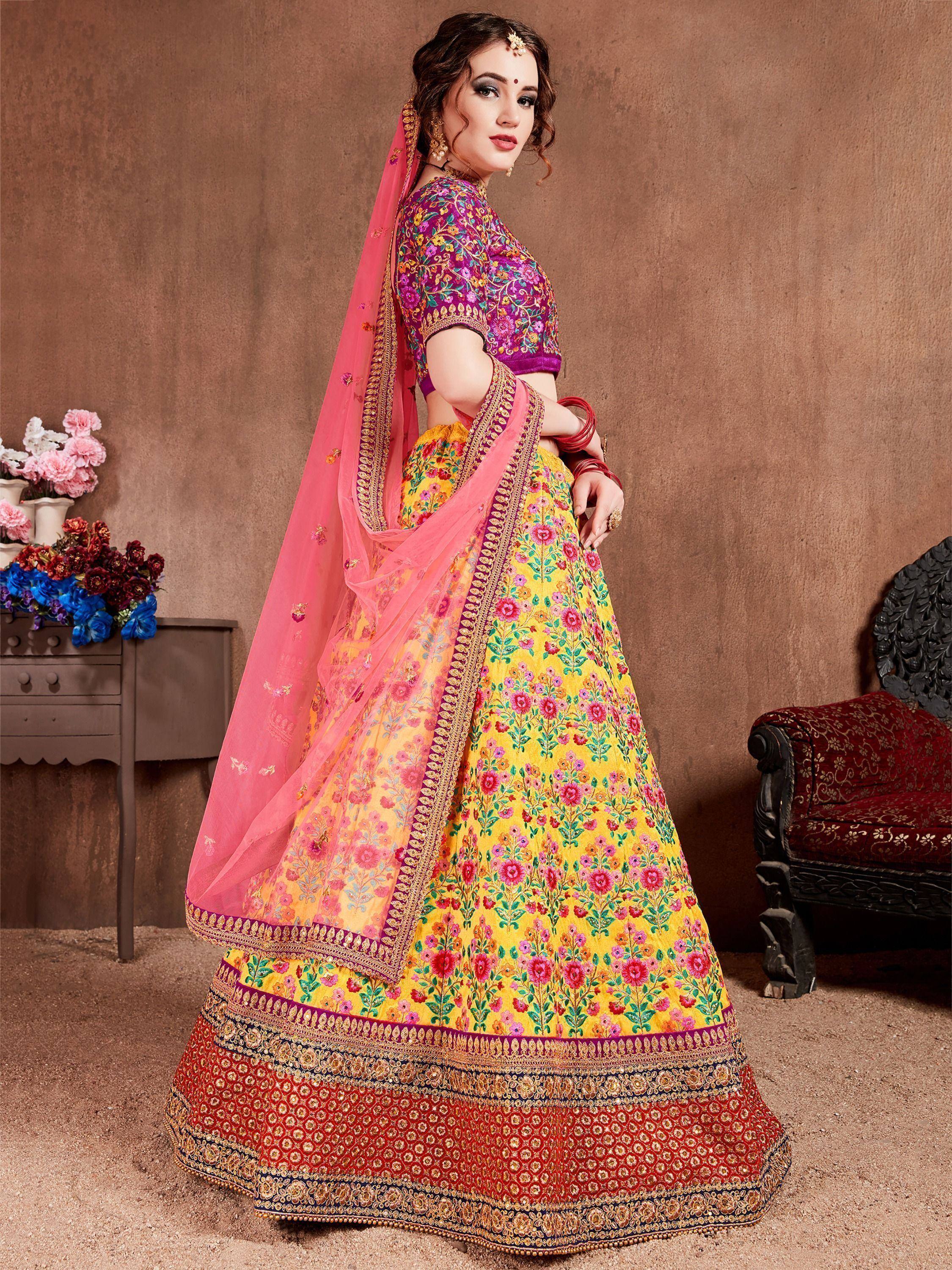 Vibrant yellow and pink floral embroidered lehenga choli with dupatta, perfect for Indian weddings and festive occasions.