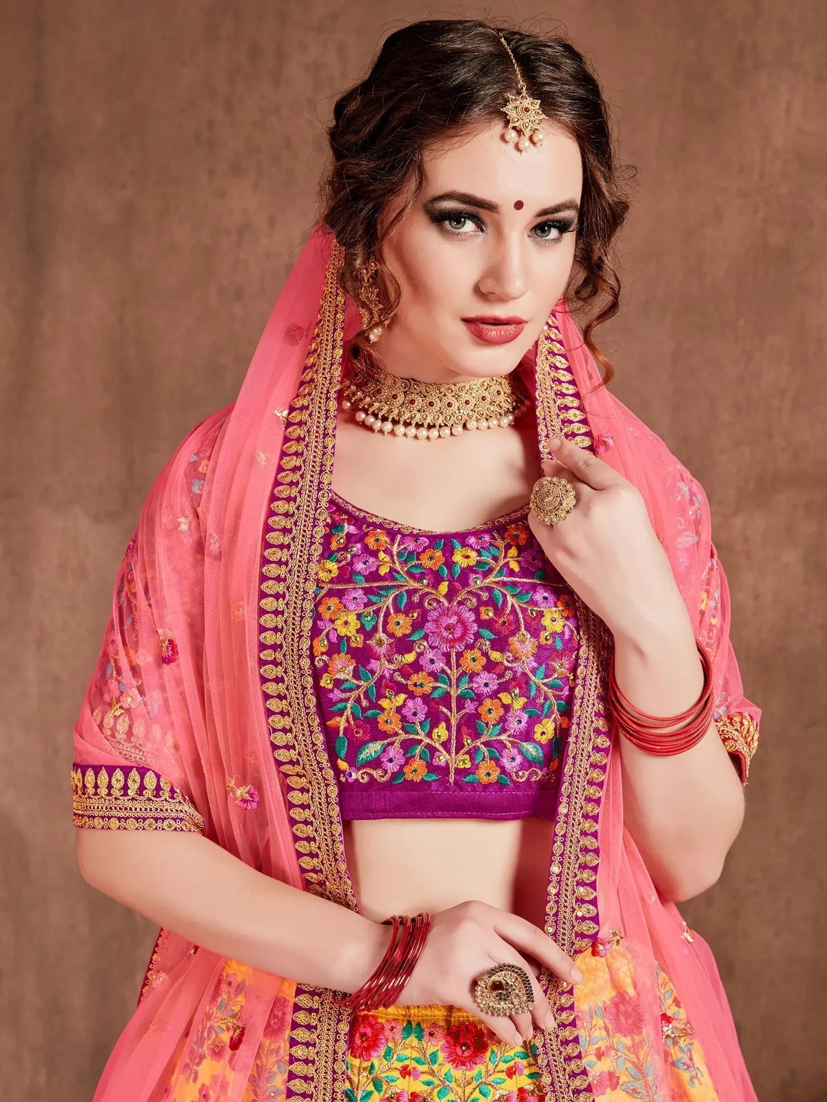 Purple floral embroidered lehenga choli with pink dupatta, traditional Indian ethnic wear for women