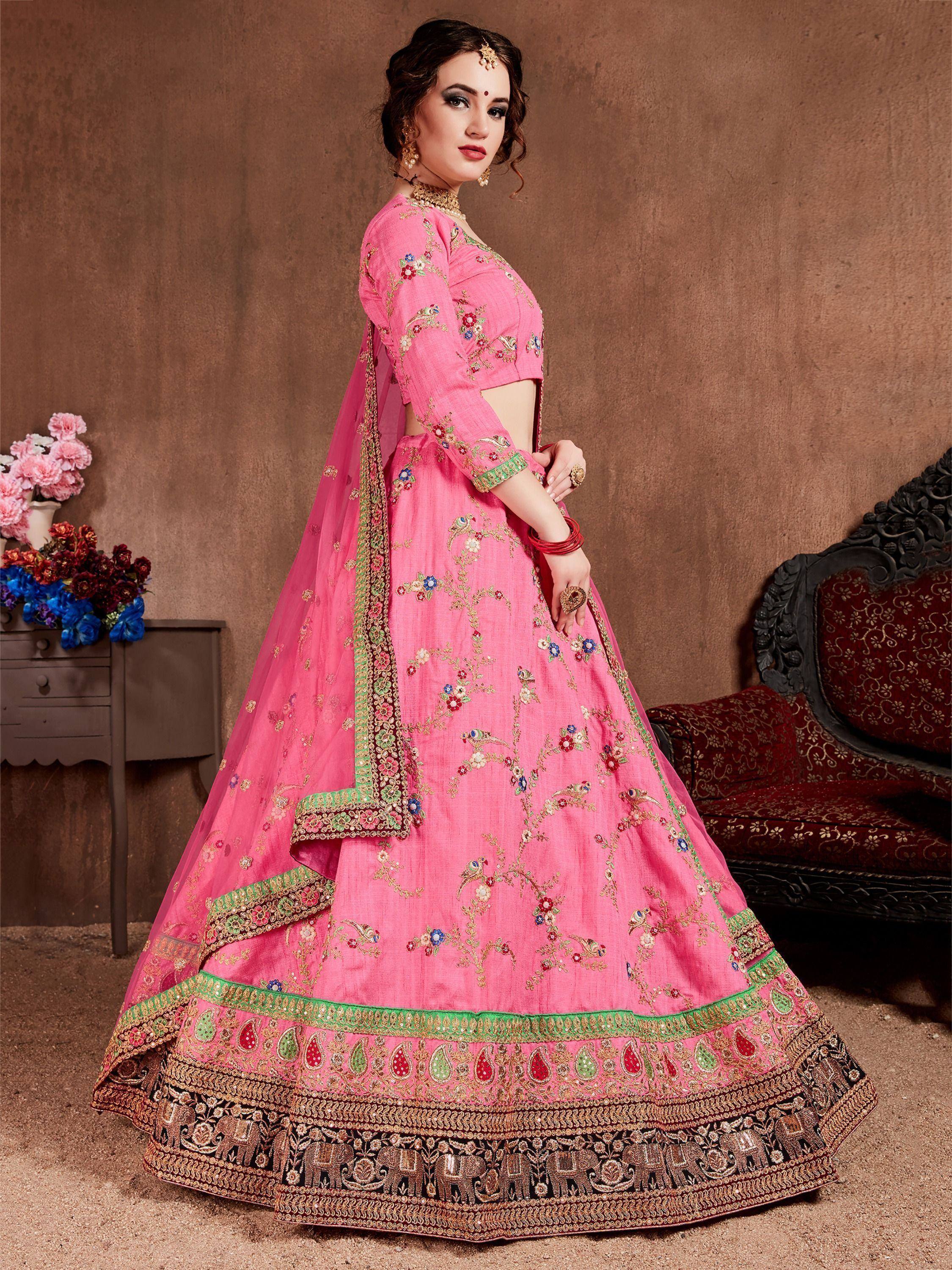Pink embroidered lehenga choli with floral and elephant motifs, perfect for Indian weddings and festive occasions.
