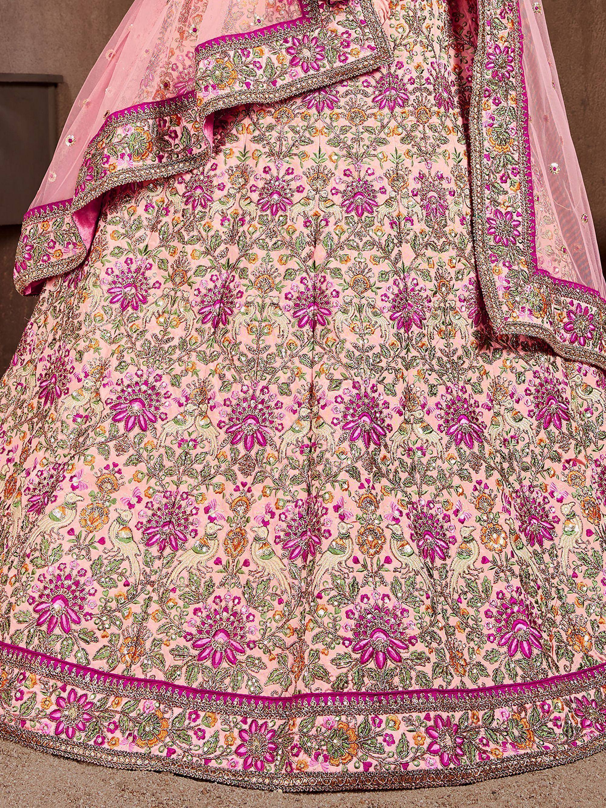 Pink floral embroidered lehenga choli with peacock motifs, perfect for Indian weddings and festive occasions.