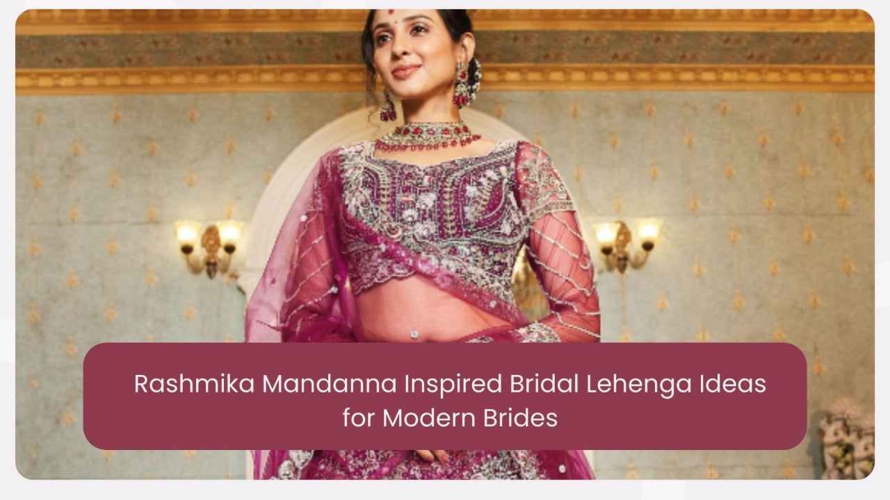 Woman in ornate magenta bridal lehenga with embroidery, wearing traditional jewelry indoors