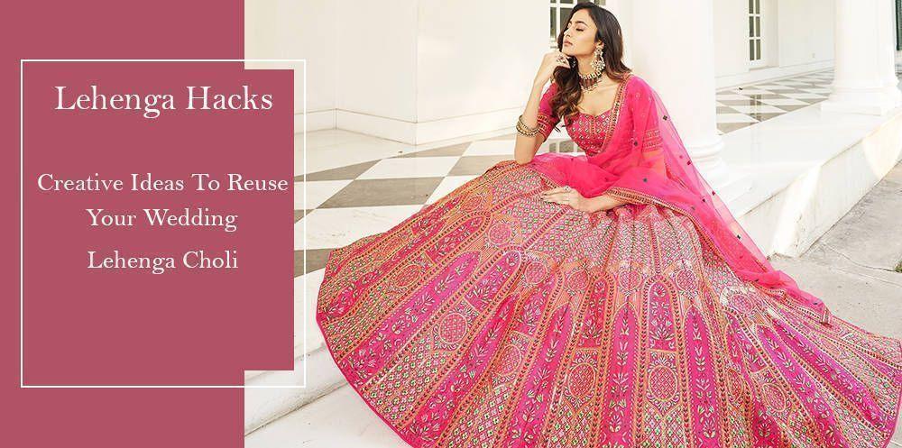 Woman wearing a pink embroidered wedding lehenga choli, traditional Indian ethnic wear