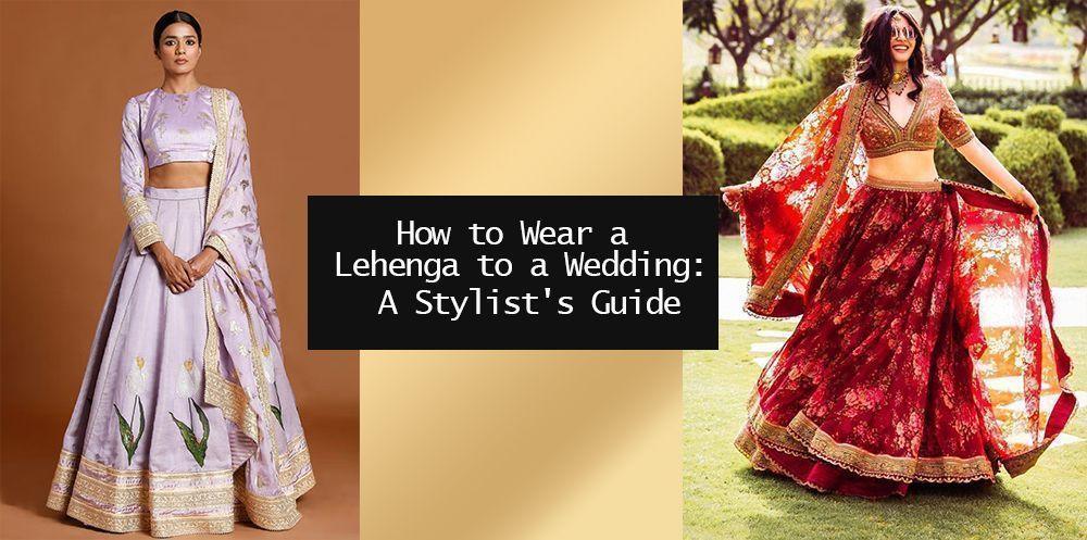 Two women wearing elegant lehenga choli outfits, one in lavender, one in red, at a wedding event.